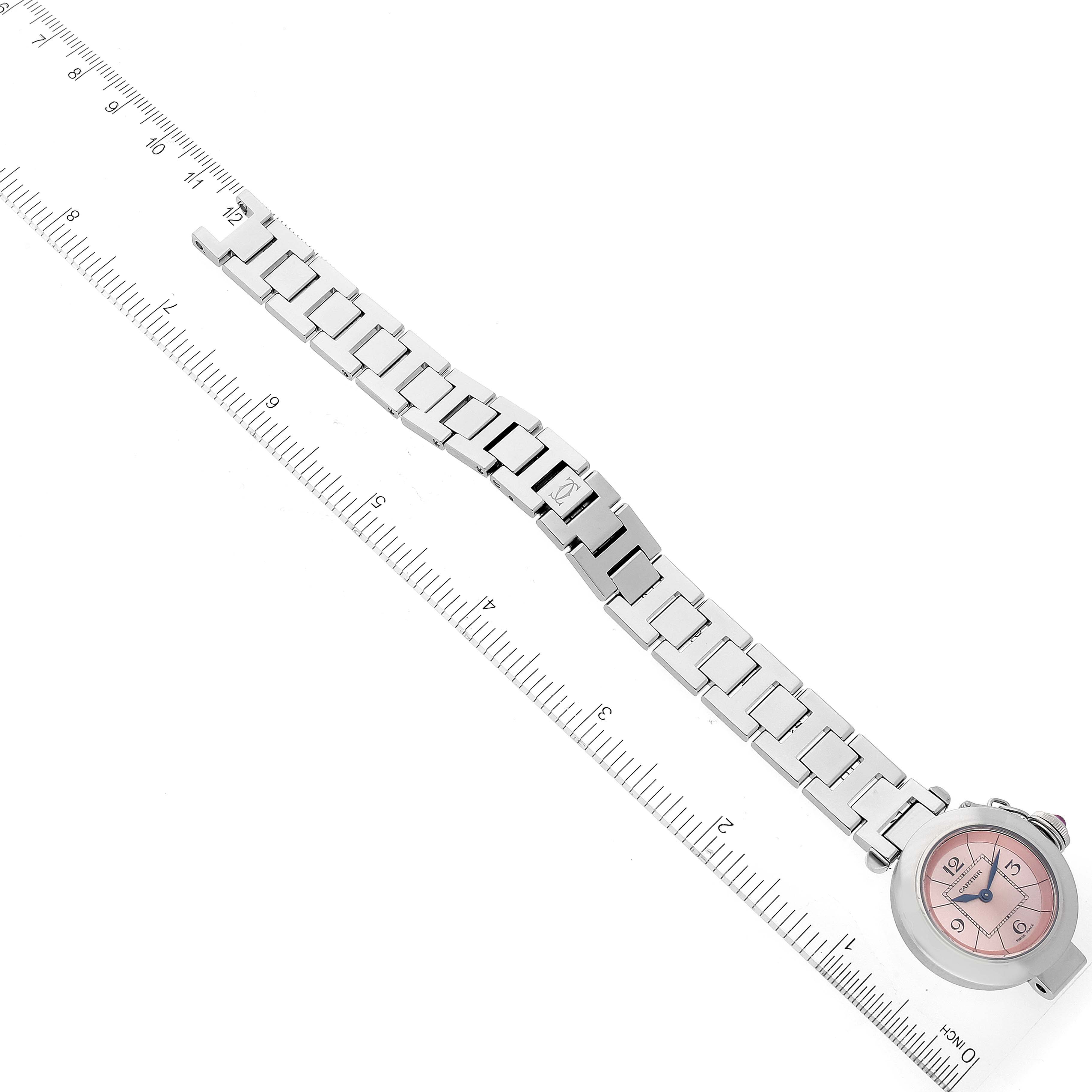 The image shows a Cartier Pasha W3140008 Women's Stainless Steel Pink Dial W3140008 Women's Stainless Steel Pink Dial watch with a pink dial, displayed flat alongside a ruler to measure its length.