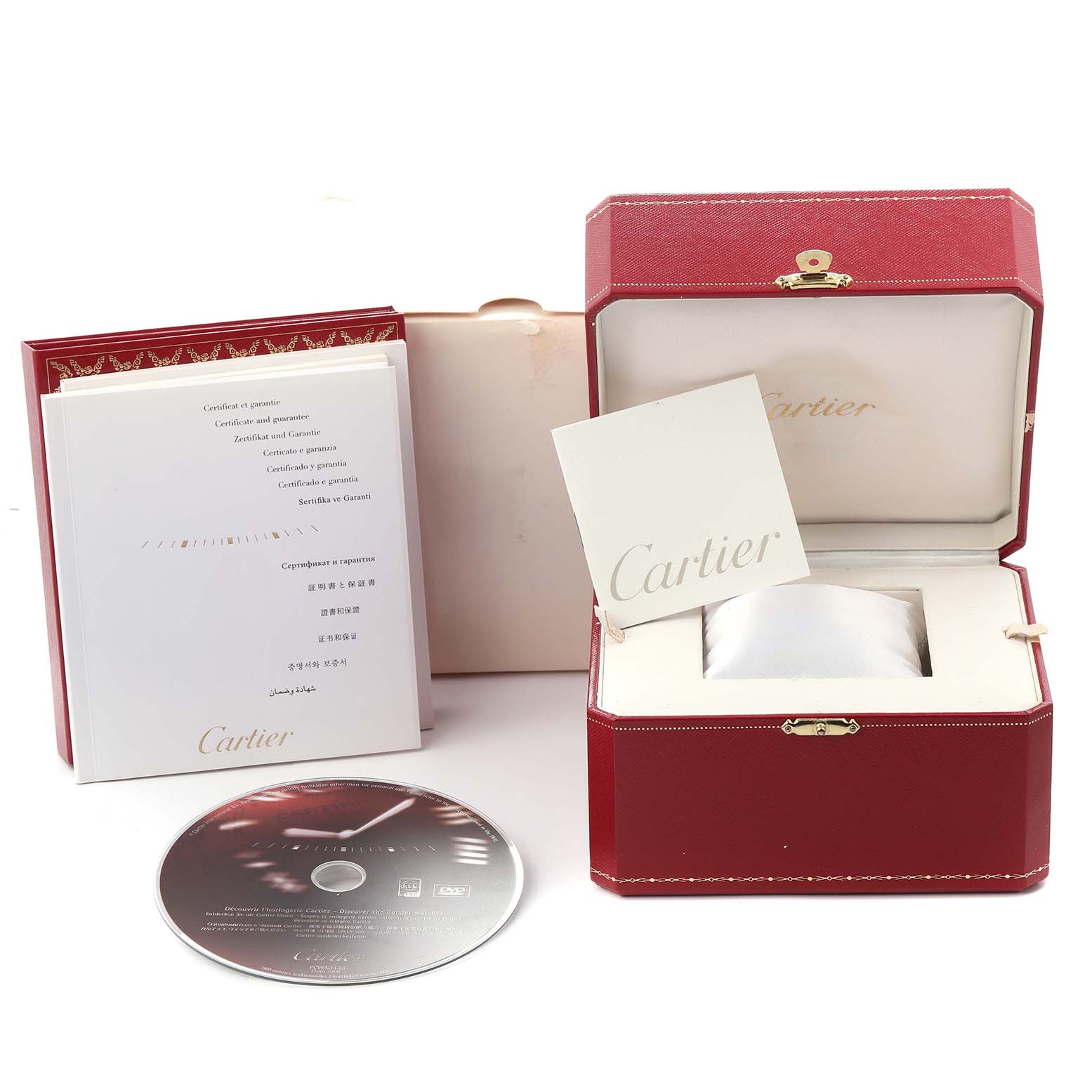 The image shows a Cartier Roadster W62025V3 Men's Stainless Steel Silver Dial W62025V3 Men's Stainless Steel Silver Dial watch box, manuals, a protective pillow, and a DVD, viewed from the front.