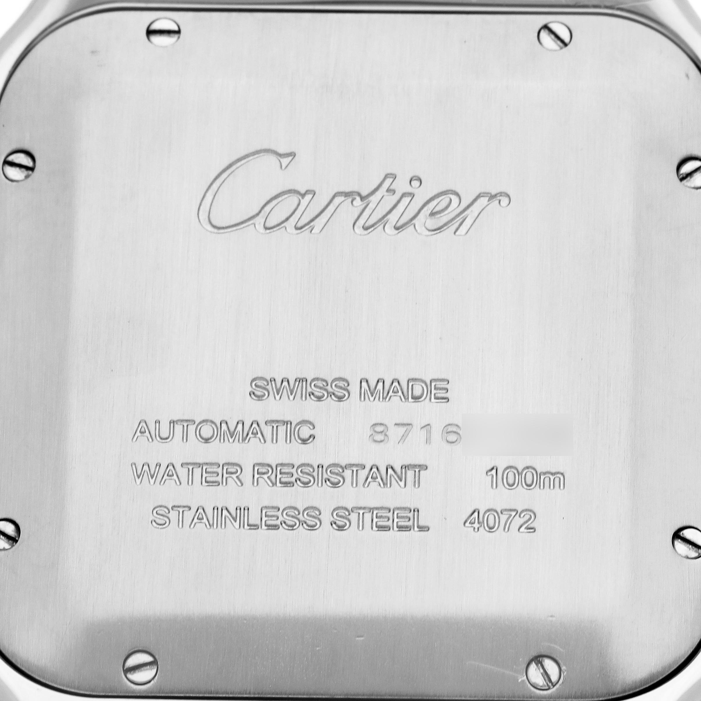 The image shows the back of a Cartier Santos W2SA0009 Men's Steel and Gold (two tone) Silver Dial W2SA0009 Men's Steel and Gold (two tone) Silver Dial watch, displaying engravings and screws.