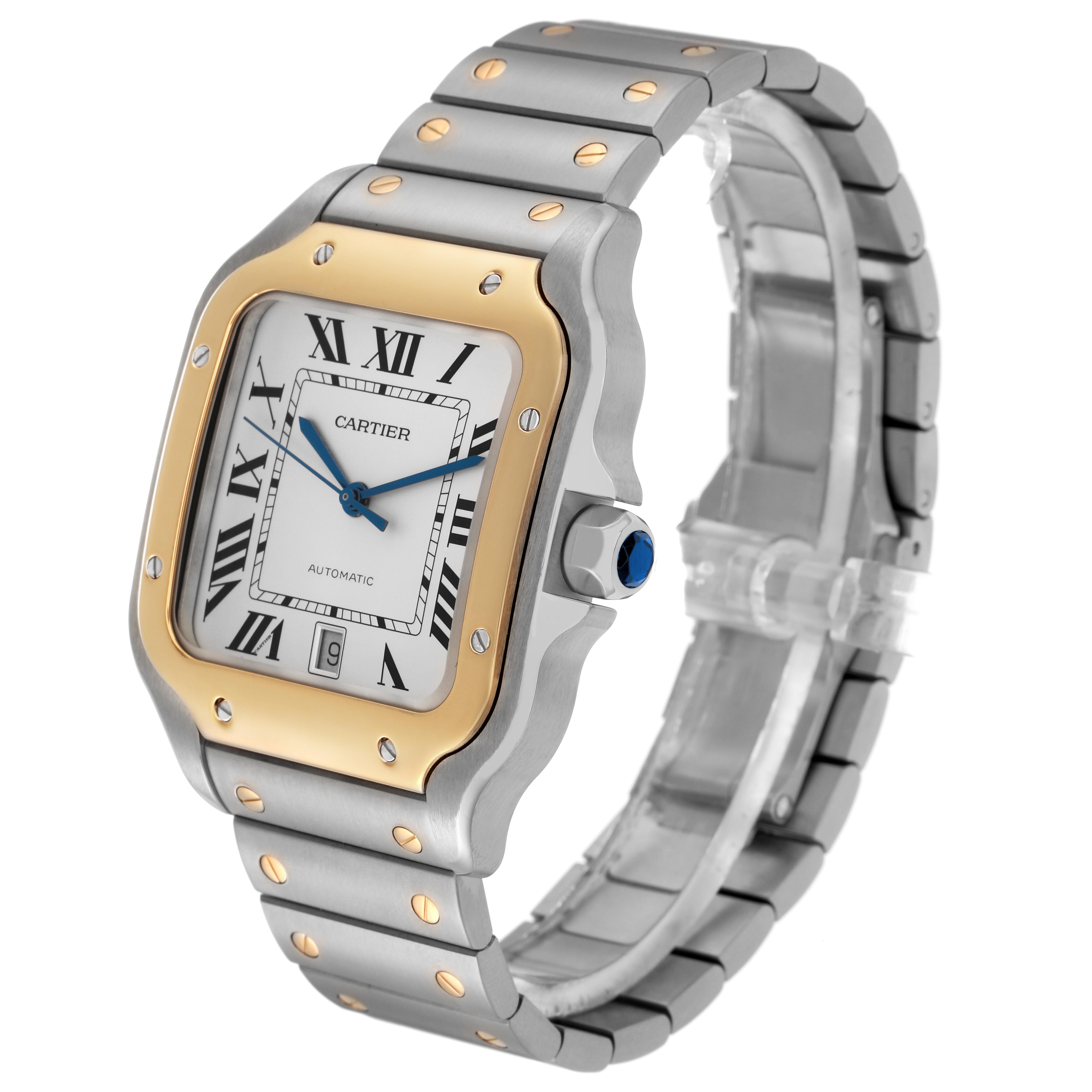 The Cartier Santos W2SA0009 Men's Steel and Gold (two tone) Silver Dial W2SA0009 Men's Steel and Gold (two tone) Silver Dial watch is shown from a three-quarter angle, displaying the face, bezel, crown, and part of the bracelet.
