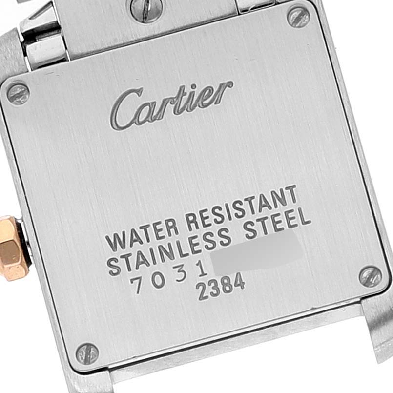 The image shows the back case of a Cartier Tank Francaise W51027Q4 Women's Steel and Gold (two tone) Mother of Pearl Dial W51027Q4 Women's Steel and Gold (two tone) Mother of Pearl Dial watch, highlighting its water resistance and stainless steel markings.