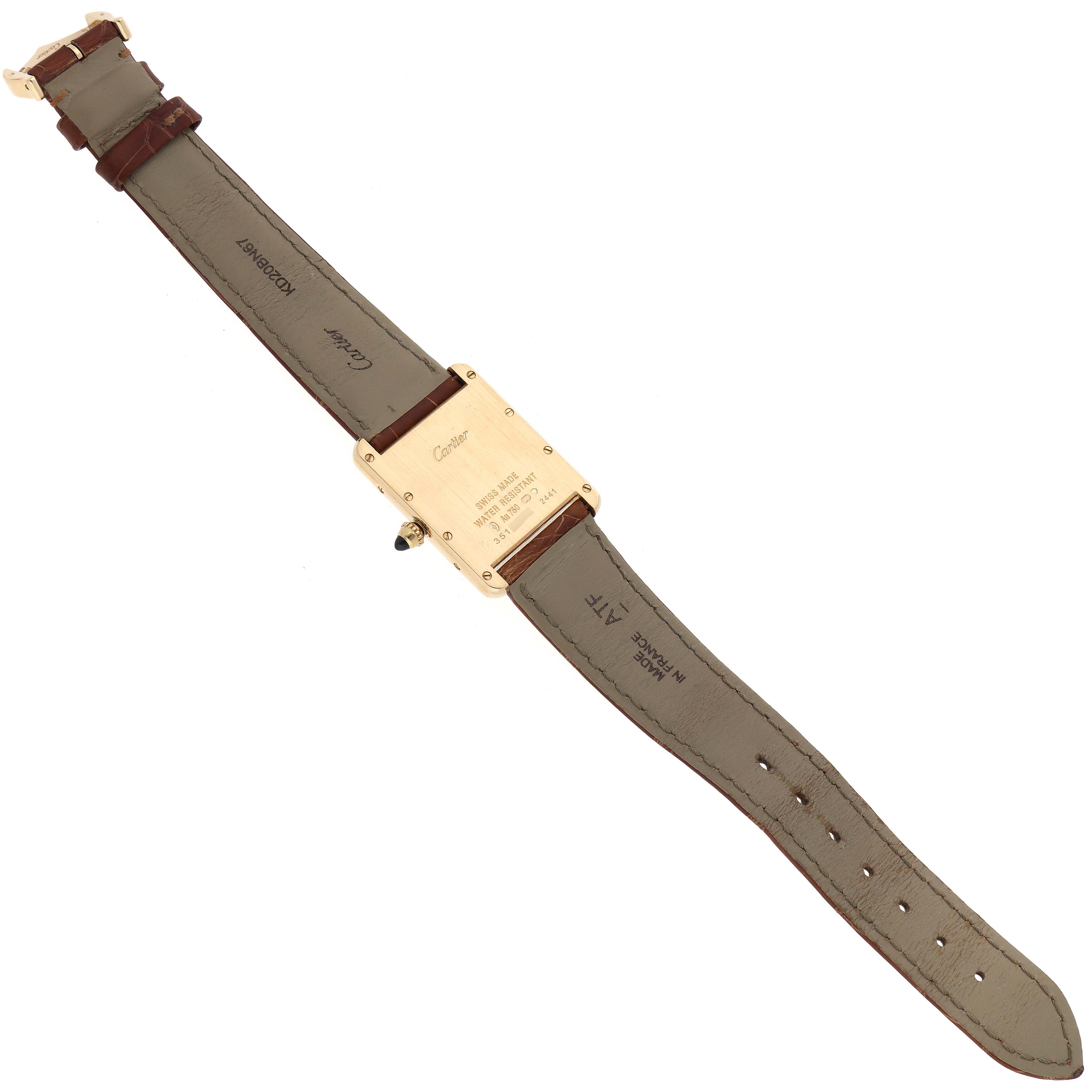 The image shows the back view of a Tank Louis watch by Cartier, displaying the case back and leather straps.