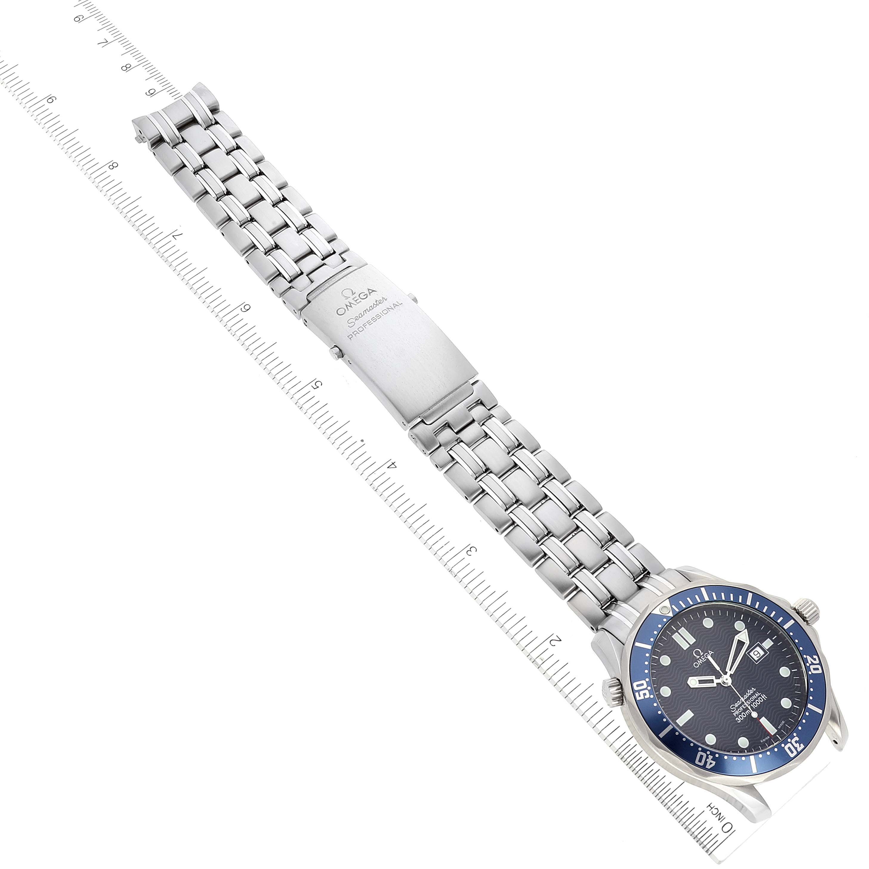 The image shows an Omega Seamaster 2541.80.00 Men's Stainless Steel Blue Dial 2541.80.00 Men's Stainless Steel Blue Dial watch laid flat, displaying its face and full metal bracelet with a ruler for scale.