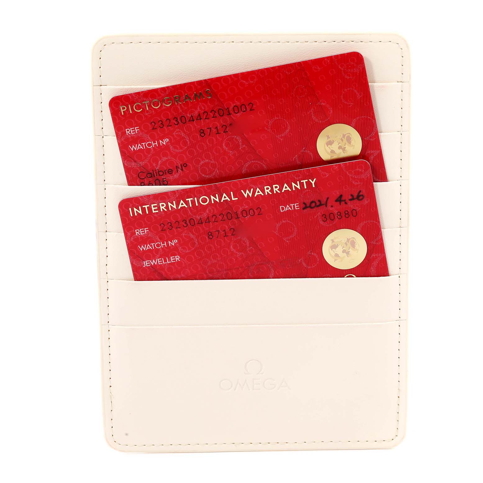 The image shows red Pictogram and International Warranty cards in a white holder for the Omega Planet Ocean 232.30.44.22.01.002 Men's Stainless Steel Black Dial 232.30.44.22.01.002 Men's Stainless Steel Black Dial watch.