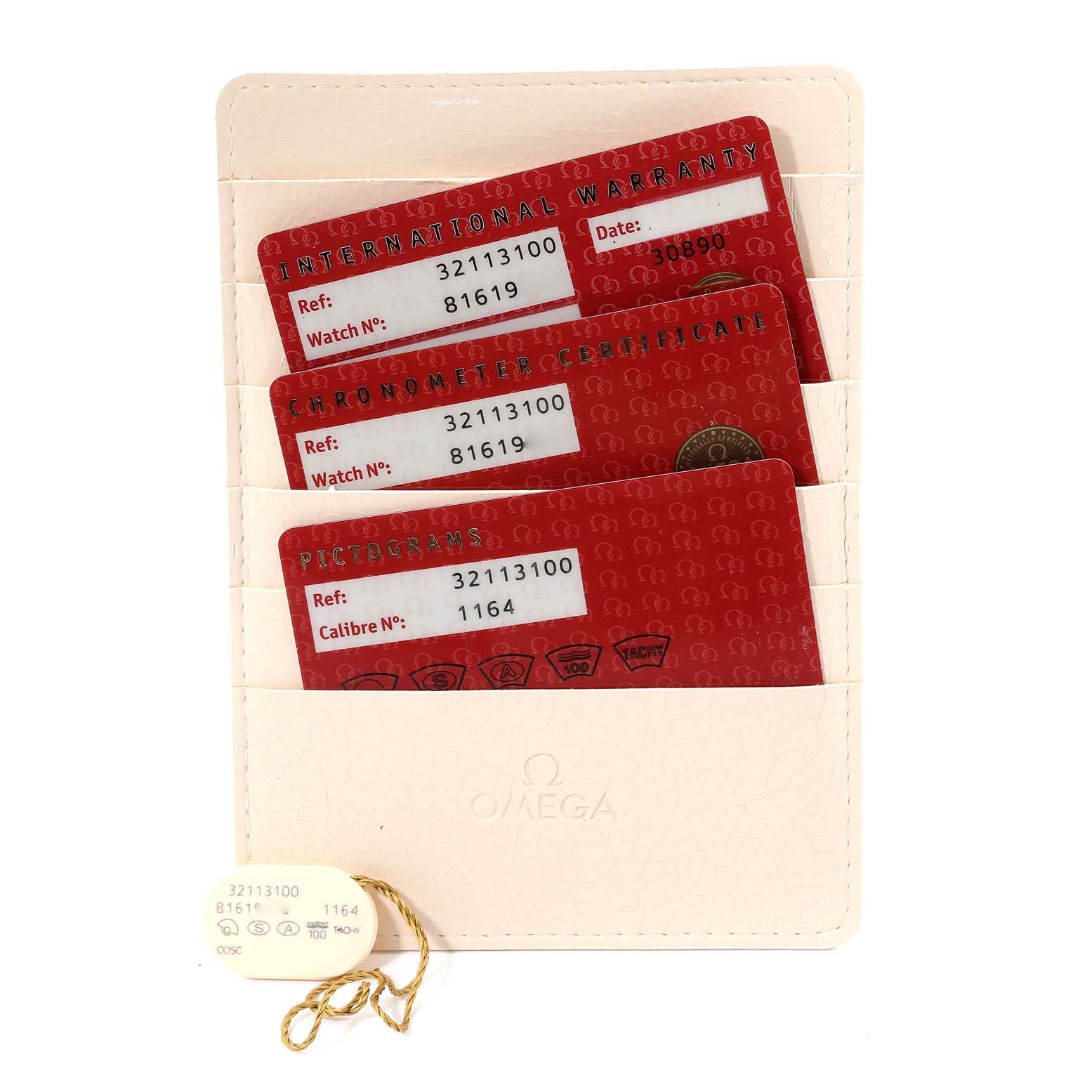 The image shows three red cards (warranty, chronometer certificate, pictograms) for the Omega Speedmaster 3211.31.00 Men's Stainless Steel Silver Dial 3211.31.00 Men's Stainless Steel Silver Dial placed in a white cardholder.