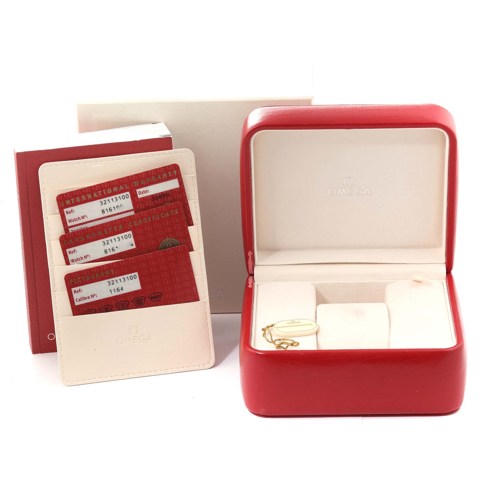 The image shows an Omega Speedmaster 3211.31.00 Men's Stainless Steel Silver Dial 3211.31.00 Men's Stainless Steel Silver Dial watch's red box, warranty cards, and white booklet from a front angle.