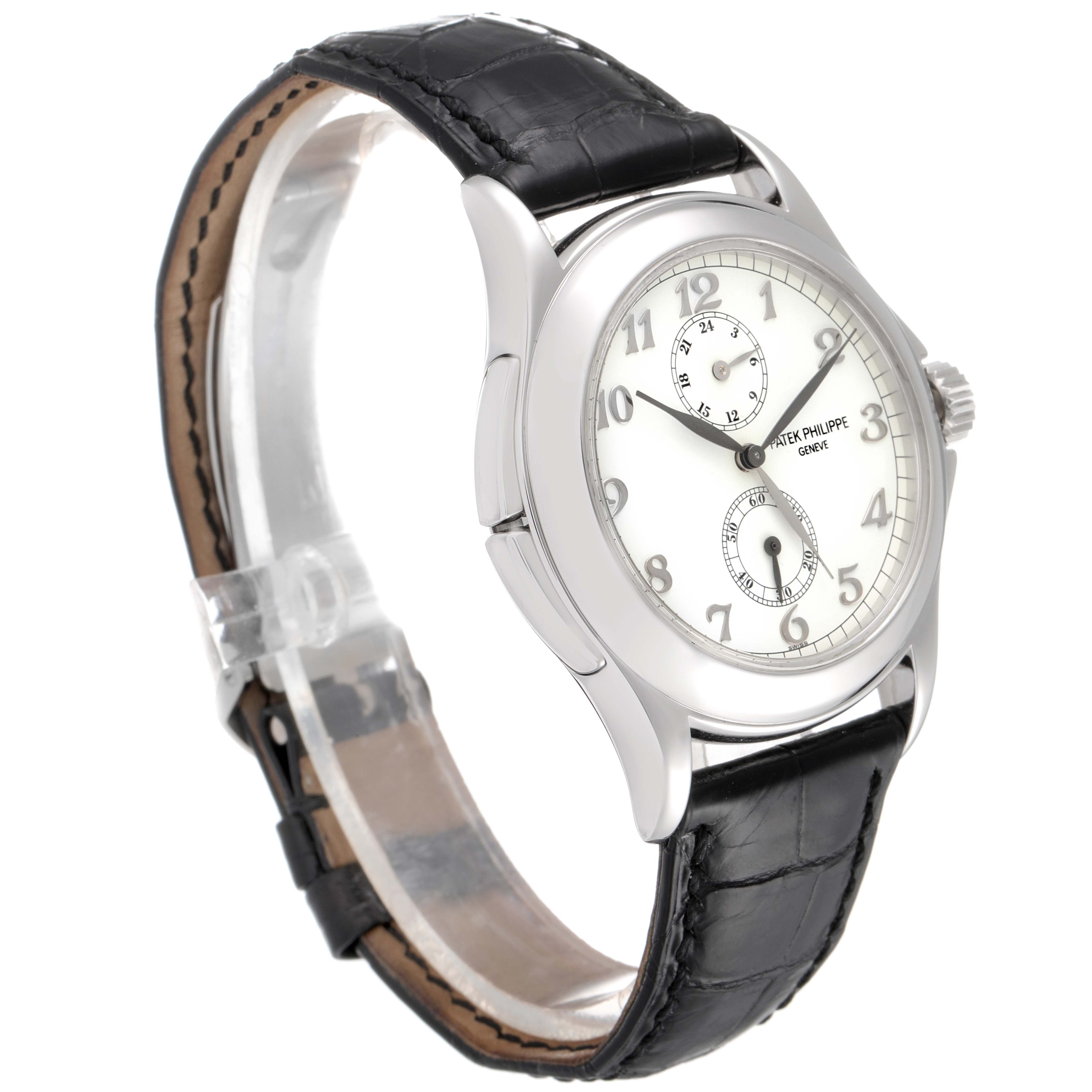 The image shows the Patek Philippe Calatrava 5134G Men
s White Gold White Dial 5134G Men
s White Gold White Dial watch at a three-quarter angle, displaying the face, bezel, case, crown, and leather strap.