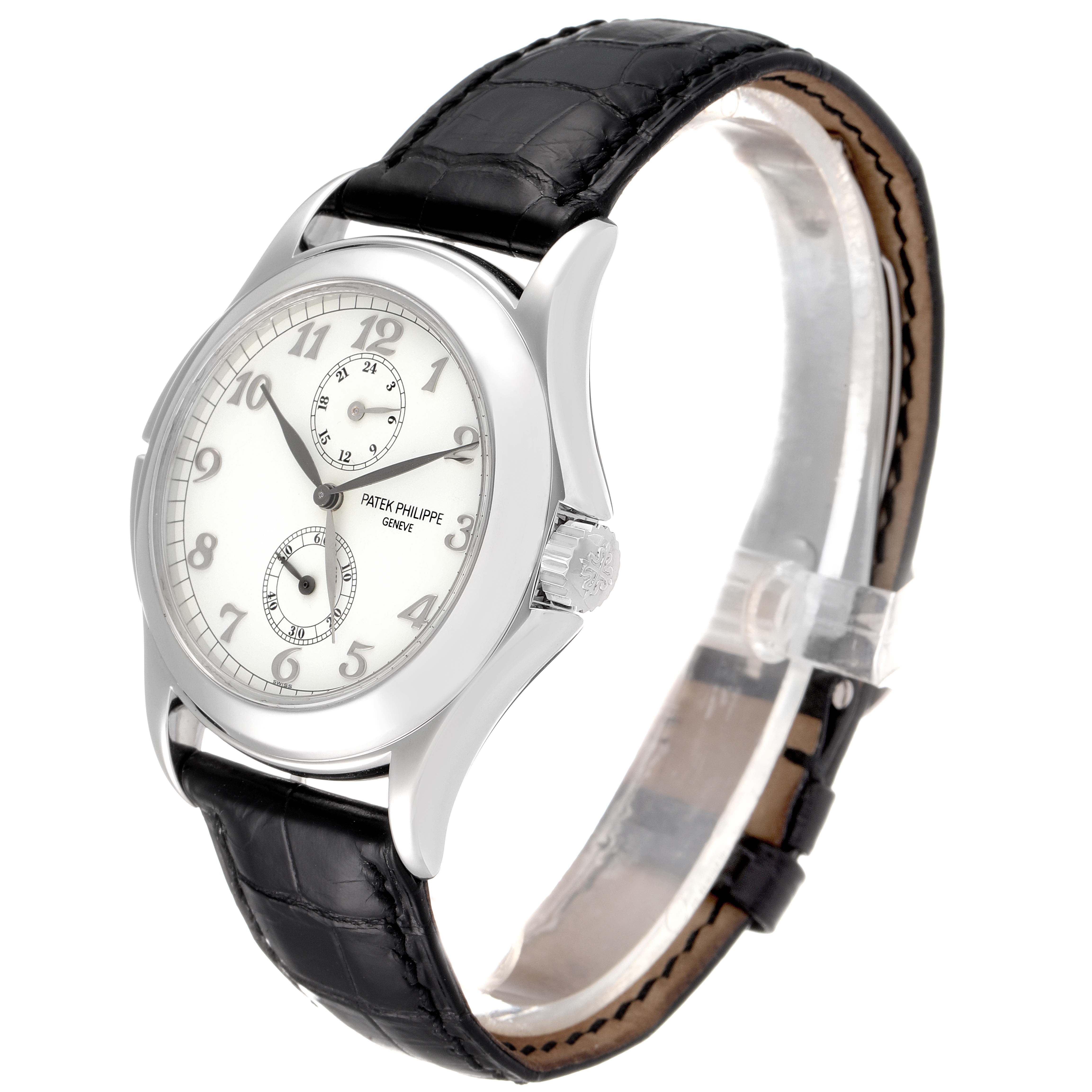 The image shows a Patek Philippe Calatrava 5134G Men
s White Gold White Dial 5134G Men
s White Gold White Dial watch at a three-quarter angle, highlighting the dial, case, strap, and crown.