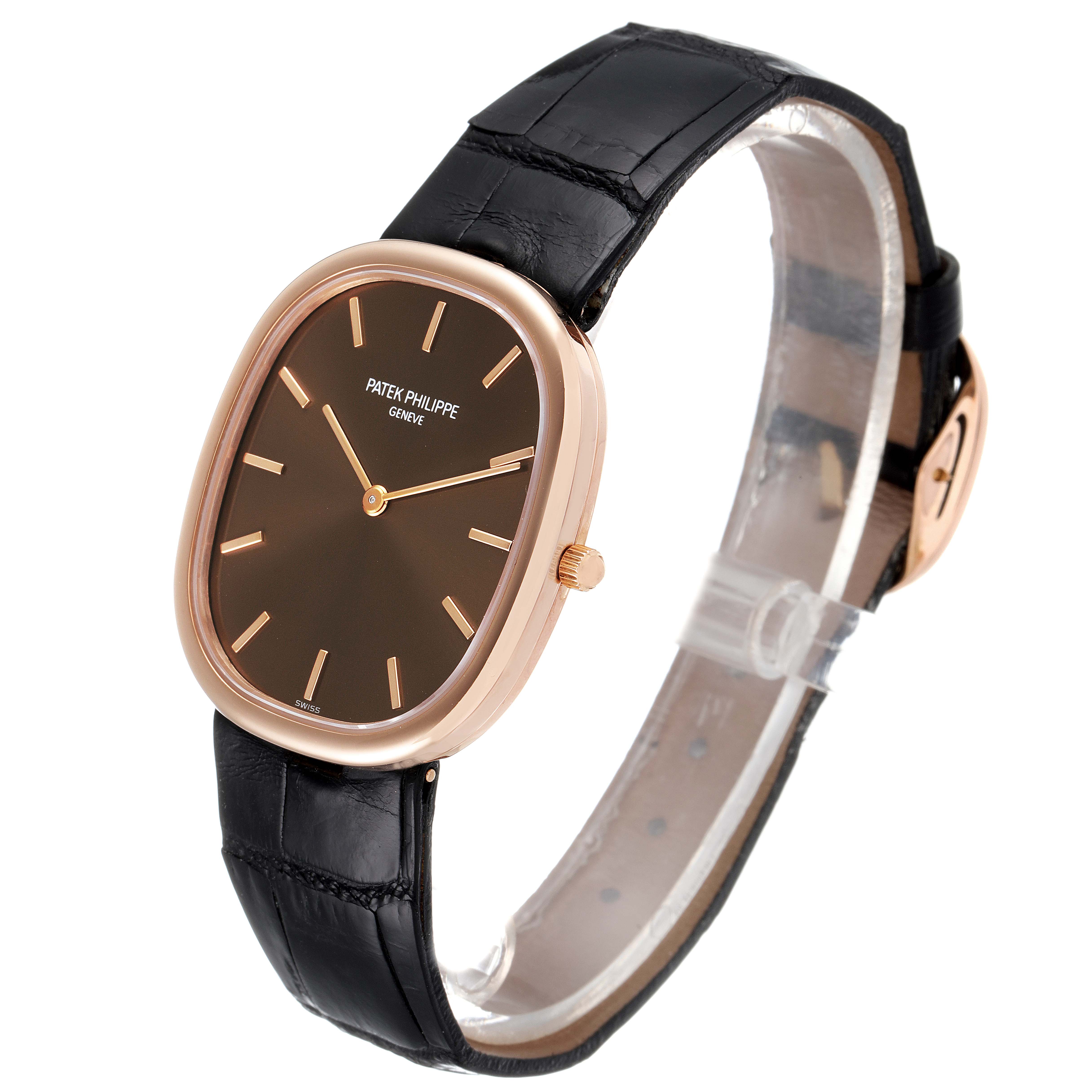 This image shows the Patek Philippe Golden Ellipse 3738 Men's Rose Gold Brown Dial 3738 Men's Rose Gold Brown Dial watch angled to display the face, case, and black leather strap.