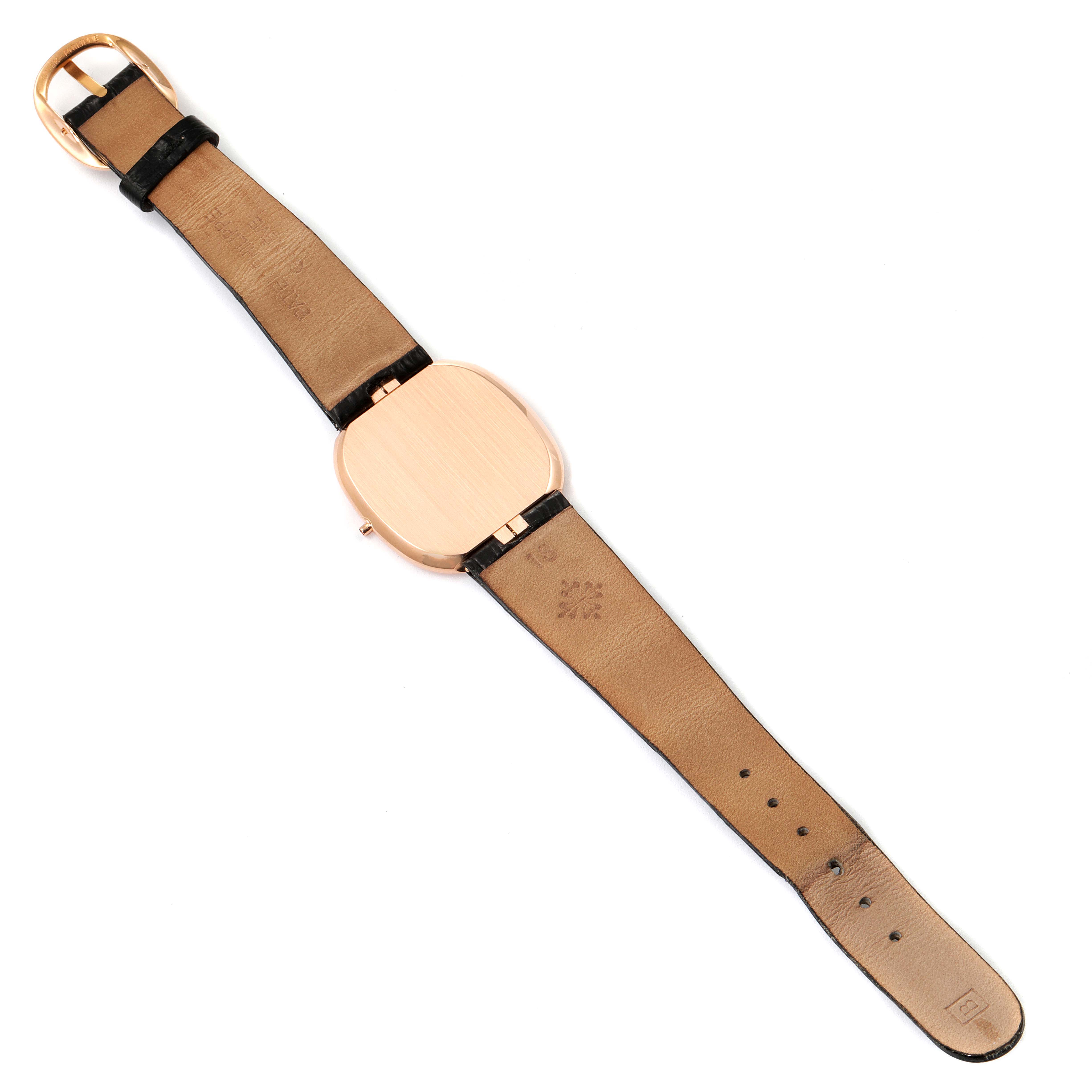 The image shows the back side and strap of a Patek Philippe Golden Ellipse 3738 Men's Rose Gold Brown Dial 3738 Men's Rose Gold Brown Dial model watch.