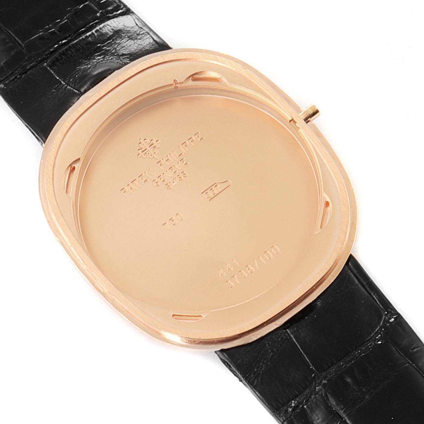 This image shows the back view of a Patek Philippe Golden Ellipse 3738 Men's Rose Gold Brown Dial 3738 Men's Rose Gold Brown Dial watch case with its cover removed and a black leather strap.