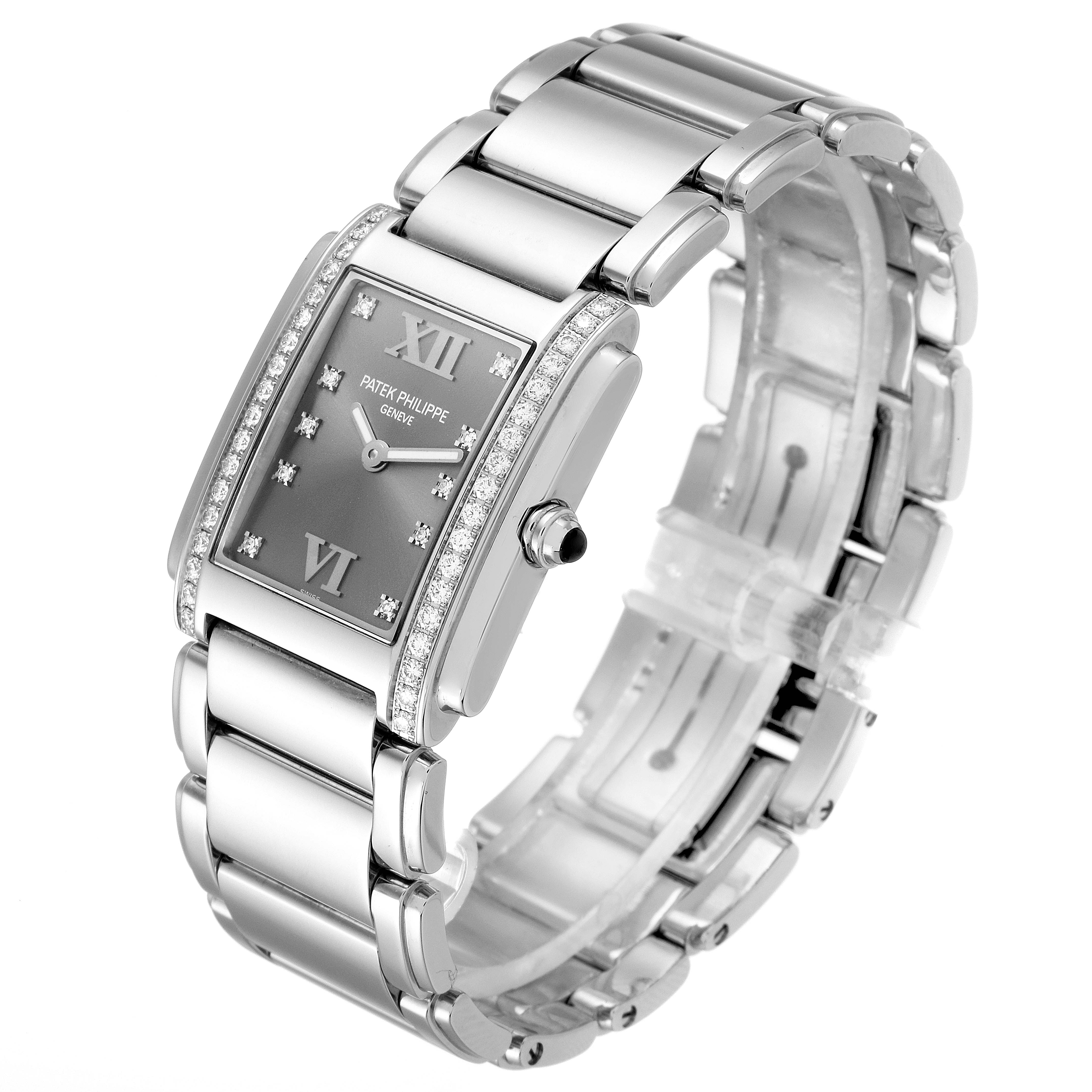 The Patek Philippe Twenty-4 4910/10A-010 Women's Stainless Steel Grey Dial 4910/10A-010 Women's Stainless Steel Grey Dial watch is shown at a three-quarter angle, highlighting the face, crown, and bracelet.