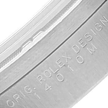 This image shows a close-up of the side of the case of a Rolex Air-King 14010 Men's Stainless Steel White Dial 14010 Men's Stainless Steel White Dial watch, with the model number and "ROLEX DESIGN" engraving.