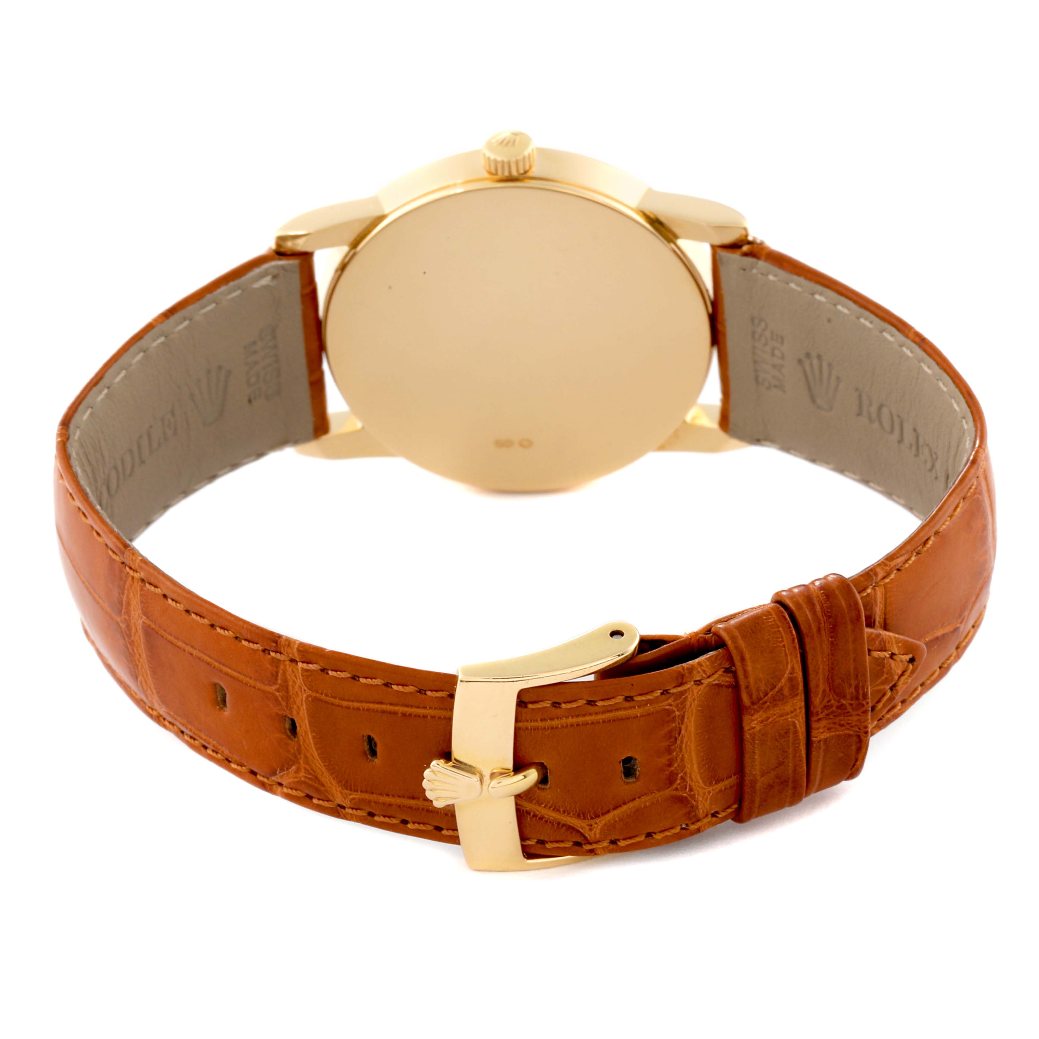 The image shows the back view of the Rolex Cellini 5116 Men's Yellow Gold Champagne Dial 5116 Men's Yellow Gold Champagne Dial watch with its gold case, crown, and brown leather strap with a gold clasp.