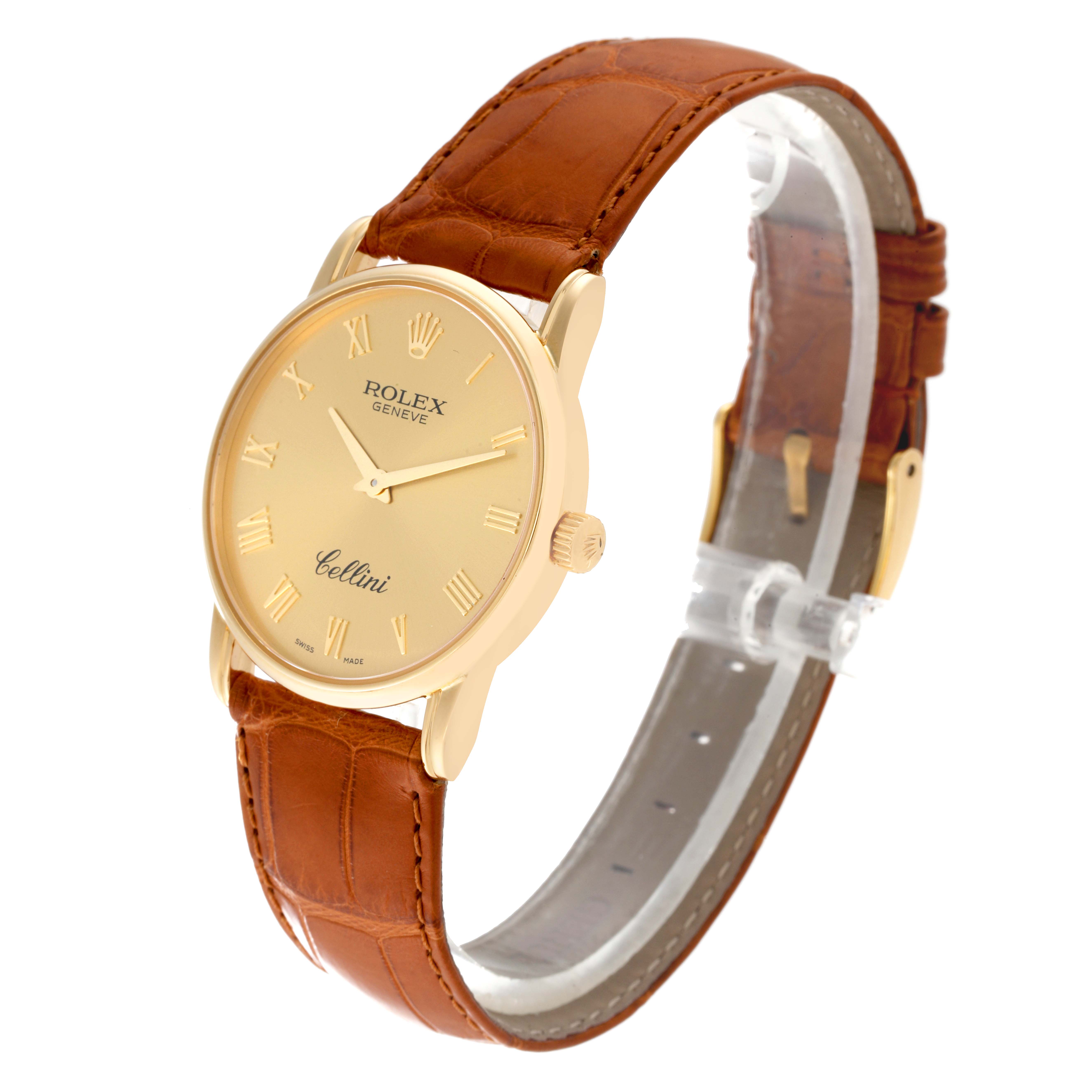 The Rolex Cellini 5116 Men's Yellow Gold Champagne Dial 5116 Men's Yellow Gold Champagne Dial watch is shown at a slight angle with a clear view of its face, brown leather strap, and gold casing.