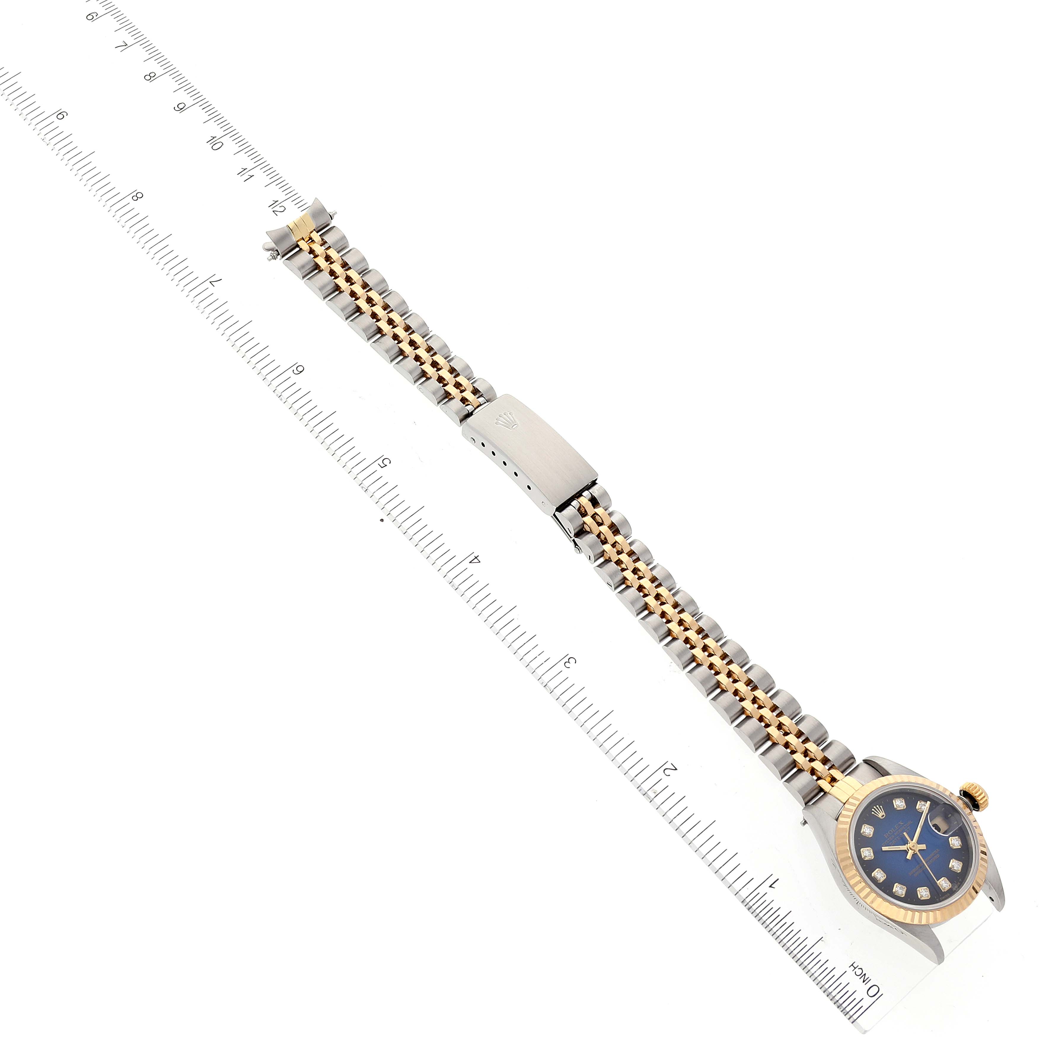 The image shows a Rolex Datejust 69173 Women's Steel and Gold (two tone) Blue Dial 69173 Women's Steel and Gold (two tone) Blue Dial watch photographed from above, featuring the face, bracelet, and clasp, alongside a ruler for scale.