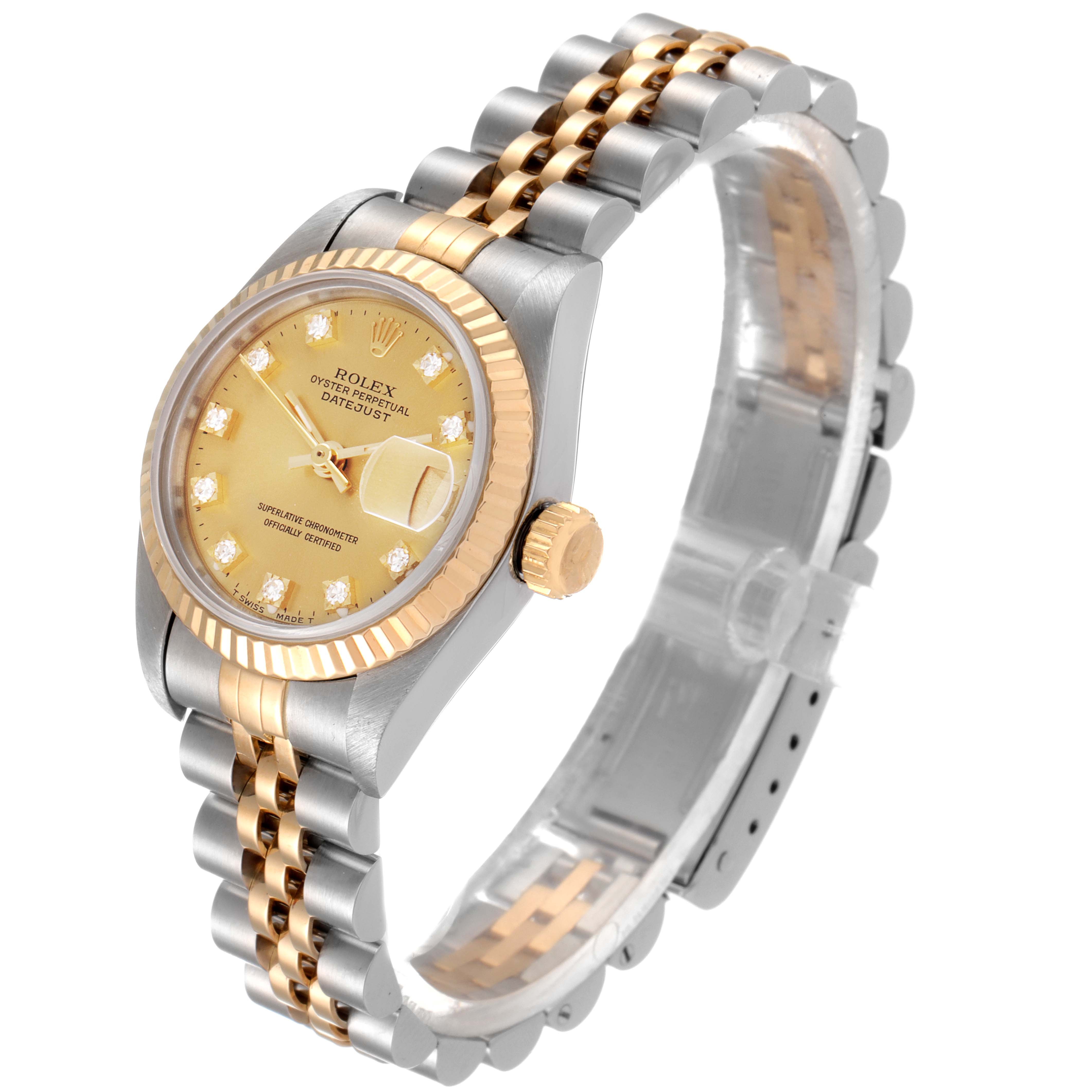 The image shows a Rolex Datejust 69173 Women
s Steel and Gold (two tone) Champagne Dial 69173 Women
s Steel and Gold (two tone) Champagne Dial watch from a front-left angle, highlighting its gold dial, bezel, jubilee bracelet, and diamond hour markers.