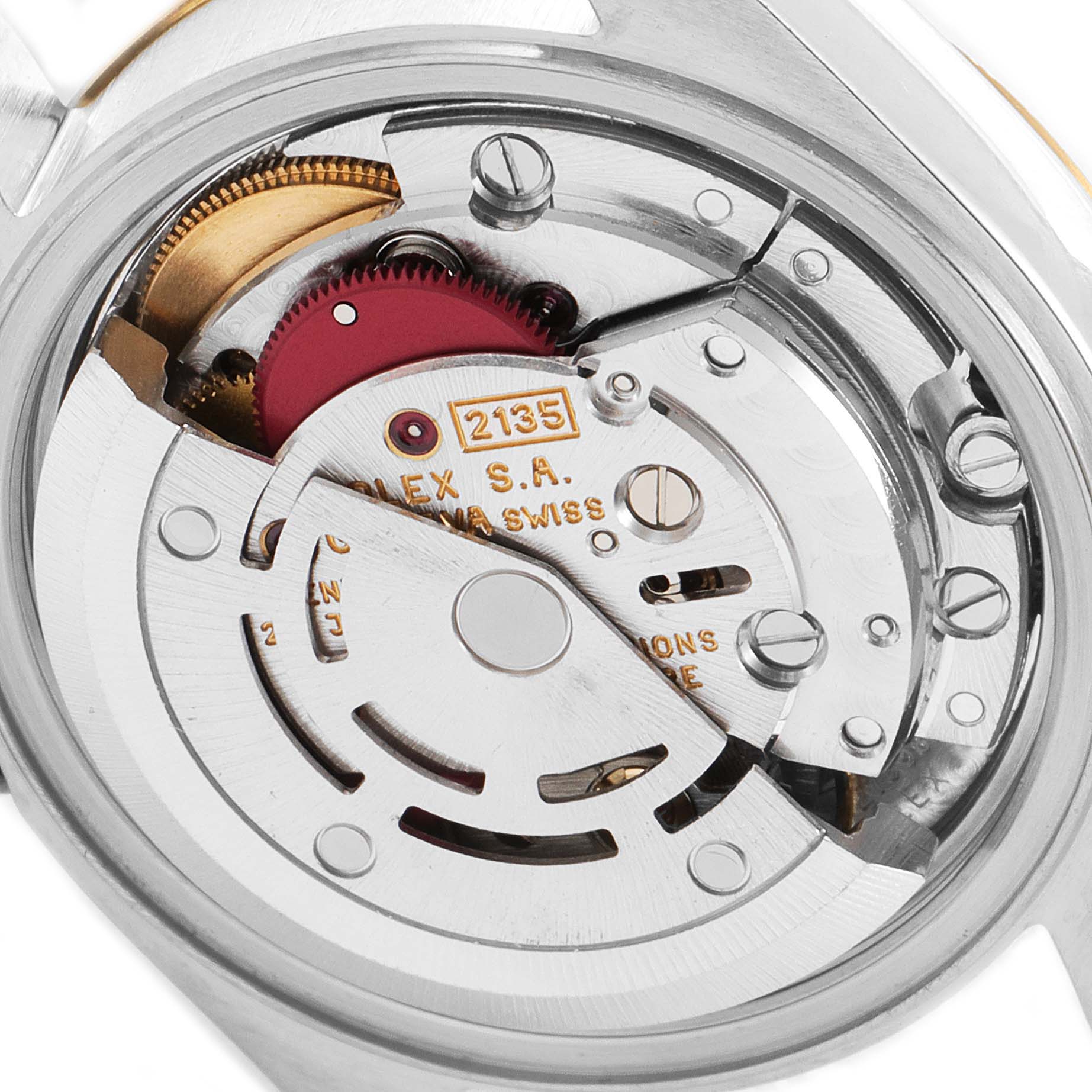 This image shows the internal mechanism of a Rolex Datejust 69173 Women
s Steel and Gold (two tone) Champagne Dial 69173 Women
s Steel and Gold (two tone) Champagne Dial watch, specifically the movement and parts of the rotor.