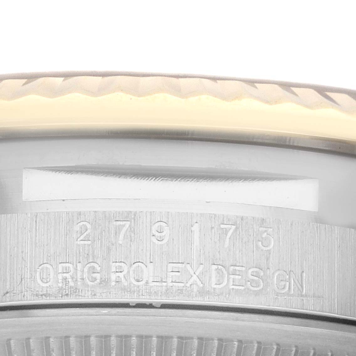 The image shows a close-up angle of the marked inner bezel and part of the fluted bezel of a Rolex Datejust 279173 Women's Steel and Gold (two tone) White Dial 279173 Women's Steel and Gold (two tone) White Dial watch.