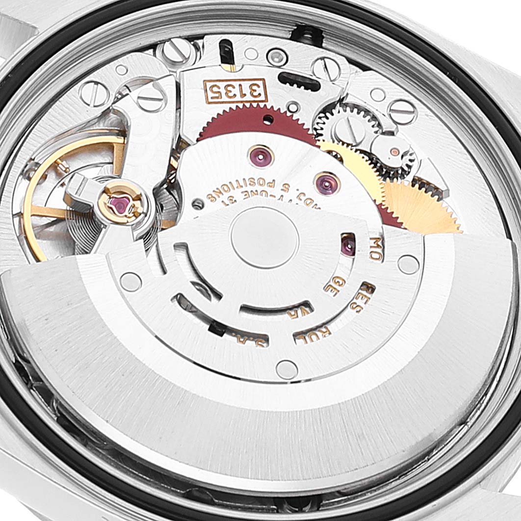 This image shows a close-up view of the intricate movement inside a Rolex Datejust 16234 Men's Stainless Steel Blue Dial 16234 Men's Stainless Steel Blue Dial watch from a top angle.