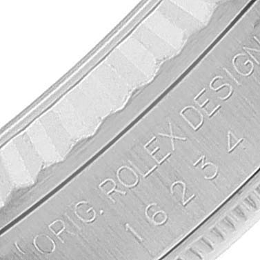 The image shows a close-up view of the side of a Rolex Datejust 16234 Men's Stainless Steel Blue Dial 16234 Men's Stainless Steel Blue Dial watch case with "ORIG. ROLEX DESIGN" and the model number engraved.