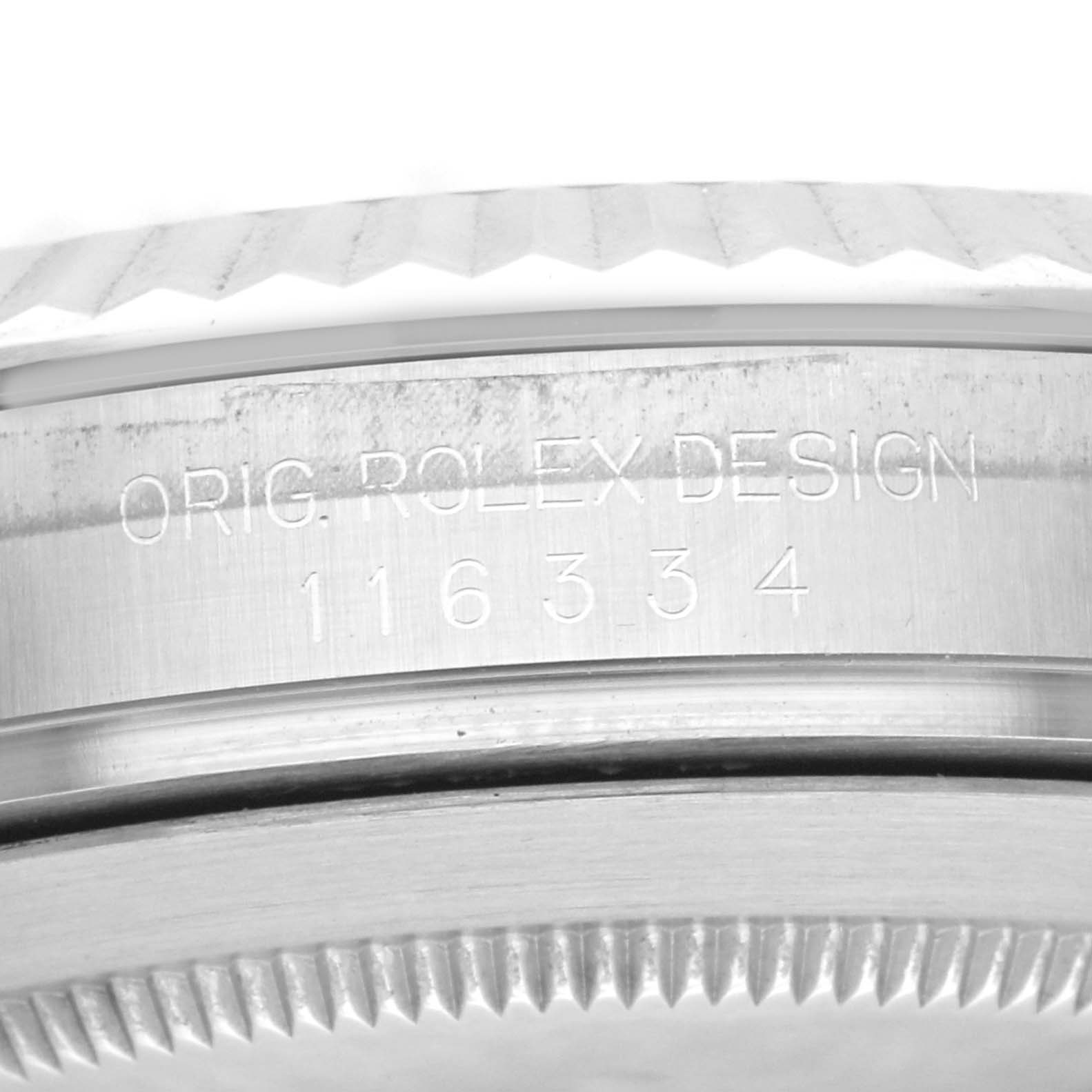 Close-up of the Rolex Datejust 41 116334 Men
s Stainless Steel Blue Dial 116334 Men
s Stainless Steel Blue Dial bezel and part of the case showing the engraved model number.