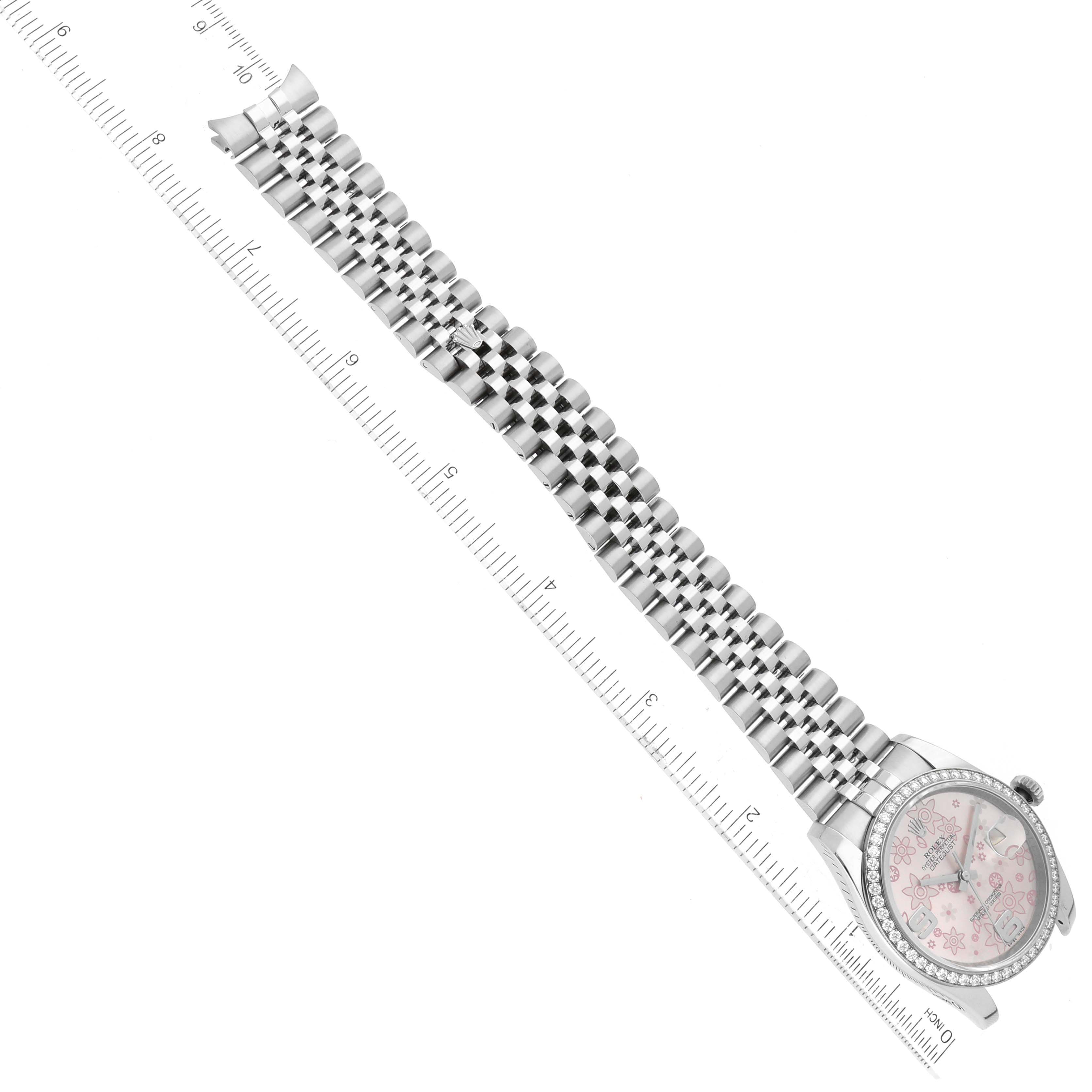 The image shows a Rolex Datejust 116244 Women's Stainless Steel Pink Dial 116244 Women's Stainless Steel Pink Dial watch laid flat, highlighting the full length of its metal bracelet and the face of the watch against a ruler.