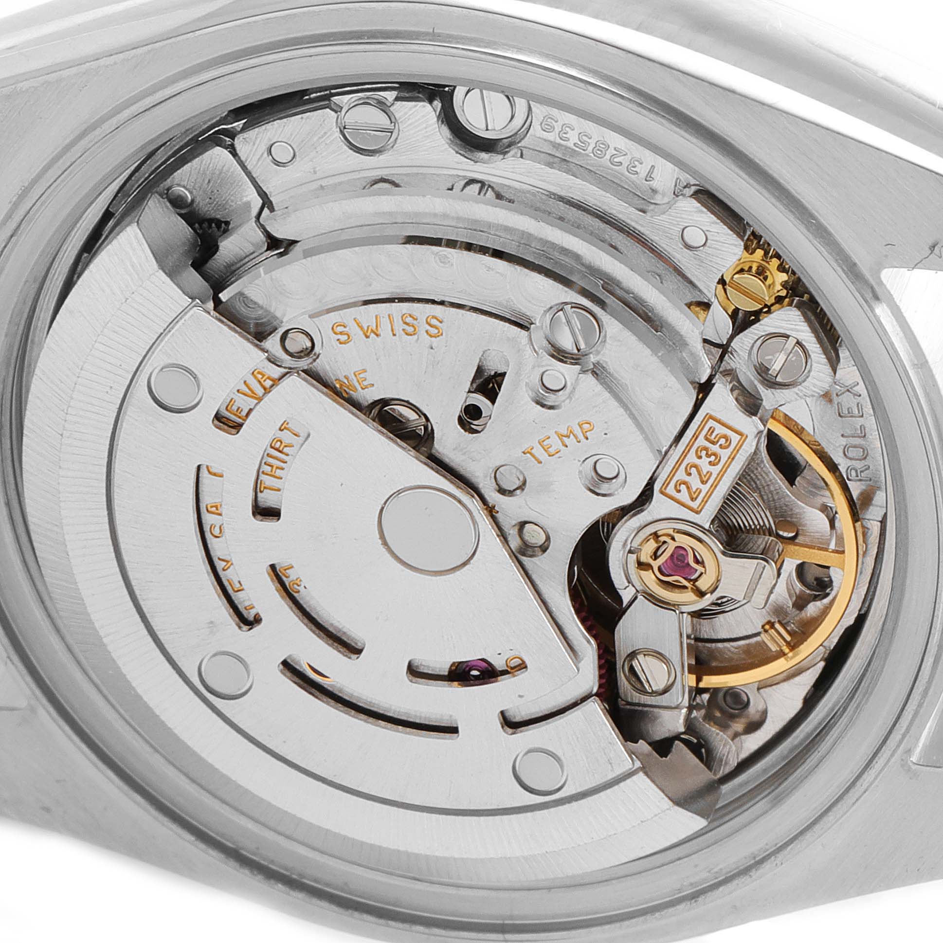 The image shows the inner mechanical movement and parts of a Rolex Datejust 79173 Women
s Steel and Gold (two tone) Black Dial 79173 Women
s Steel and Gold (two tone) Black Dial watch from a close-up, back angle view.