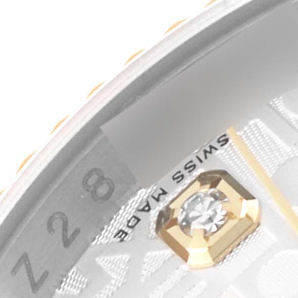 This image shows a close-up of the dial, part of the bezel, and a diamond hour marker of a Rolex Datejust 116233 Men's Steel and Gold (two tone) Silver Dial 116233 Men's Steel and Gold (two tone) Silver Dial watch.