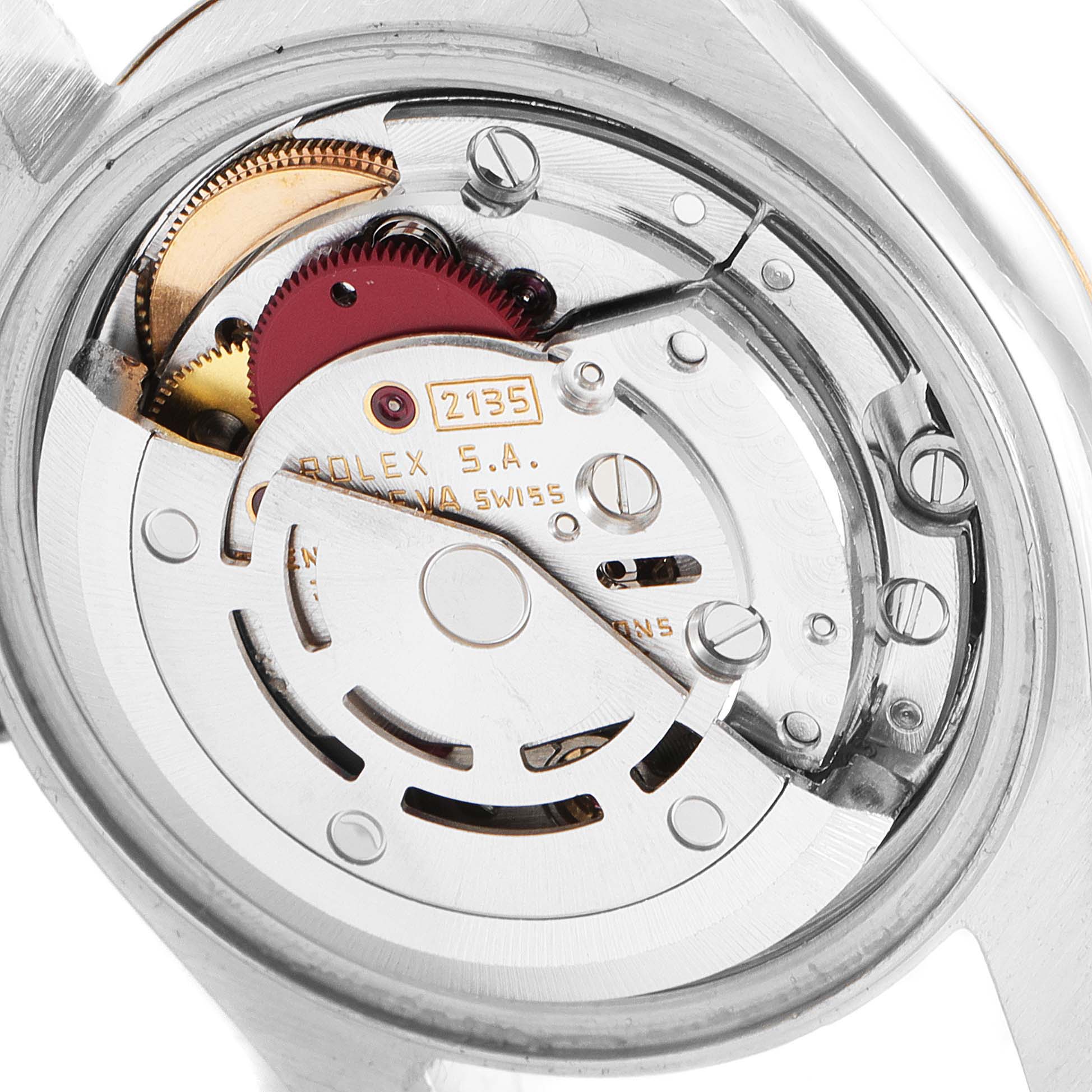 The image shows a close-up of the Datejust model
s movement and inner mechanism by Rolex from the back angle.