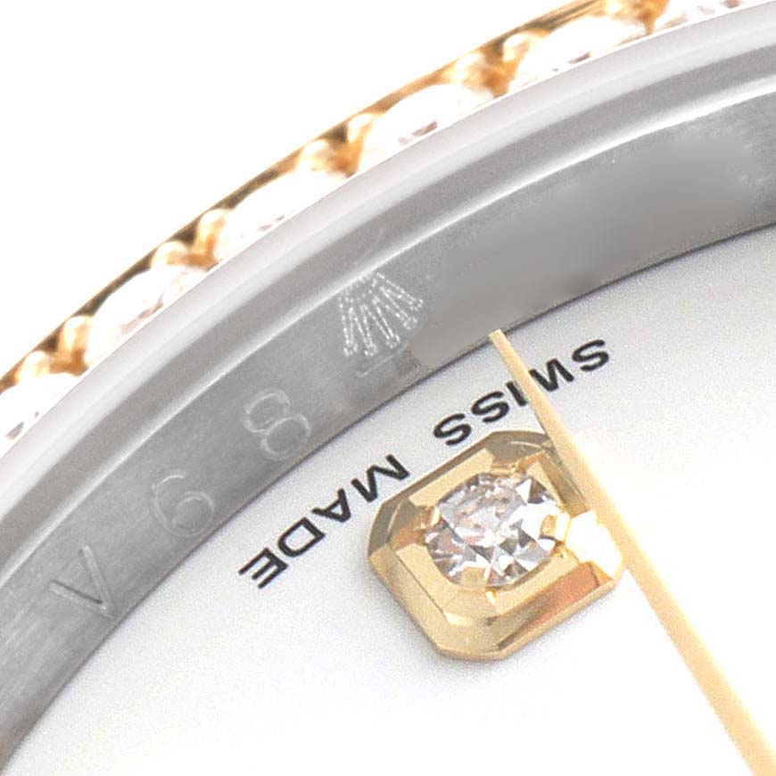 This close-up image shows the dial and diamond marker of a Rolex Datejust 116243 Men's Steel and Gold (two tone) White Dial 116243 Men's Steel and Gold (two tone) White Dial watch, including part of the bezel and "Swiss Made" text.