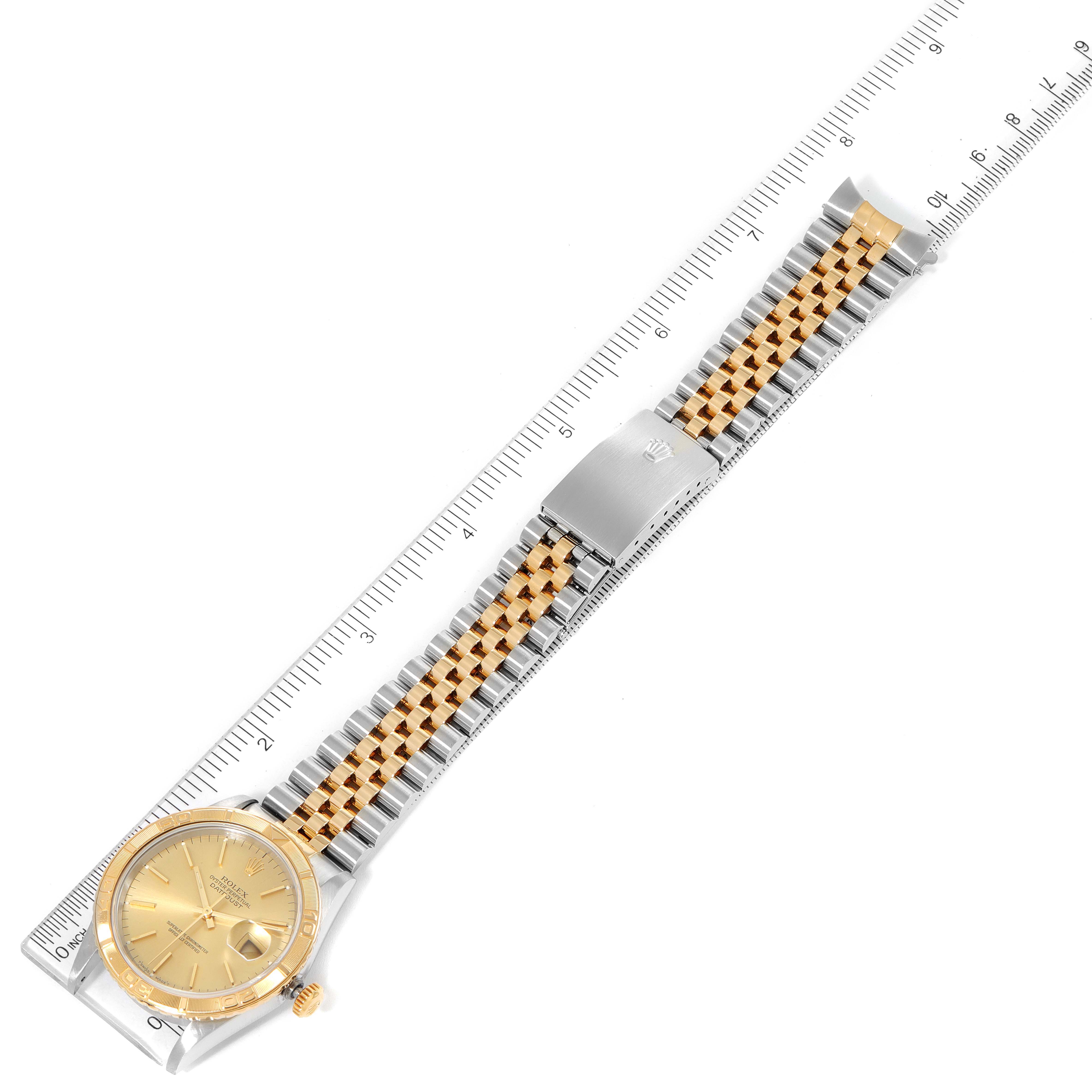 The image shows a Rolex Turn-o-Graph 16263 Men
s Steel and Gold (two tone) Champagne Dial 16263 Men
s Steel and Gold (two tone) Champagne Dial watch laid flat, displaying the dial, bezel, crown, and jubilee bracelet with a ruler for measurement.