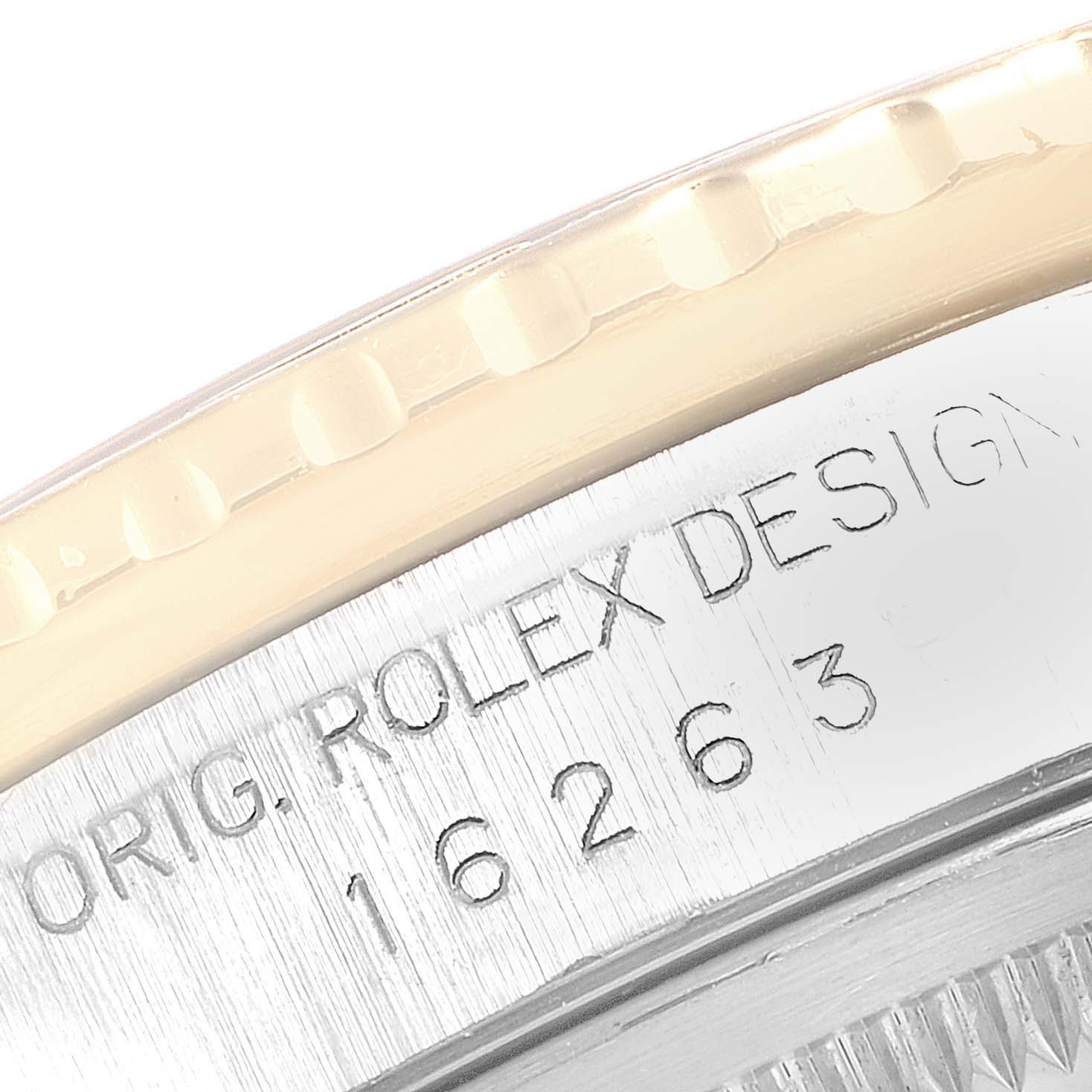 This close-up angle shows the engraved case side of the Rolex Turn-o-Graph 16263 Men
s Steel and Gold (two tone) Champagne Dial 16263 Men
s Steel and Gold (two tone) Champagne Dial model 16263.