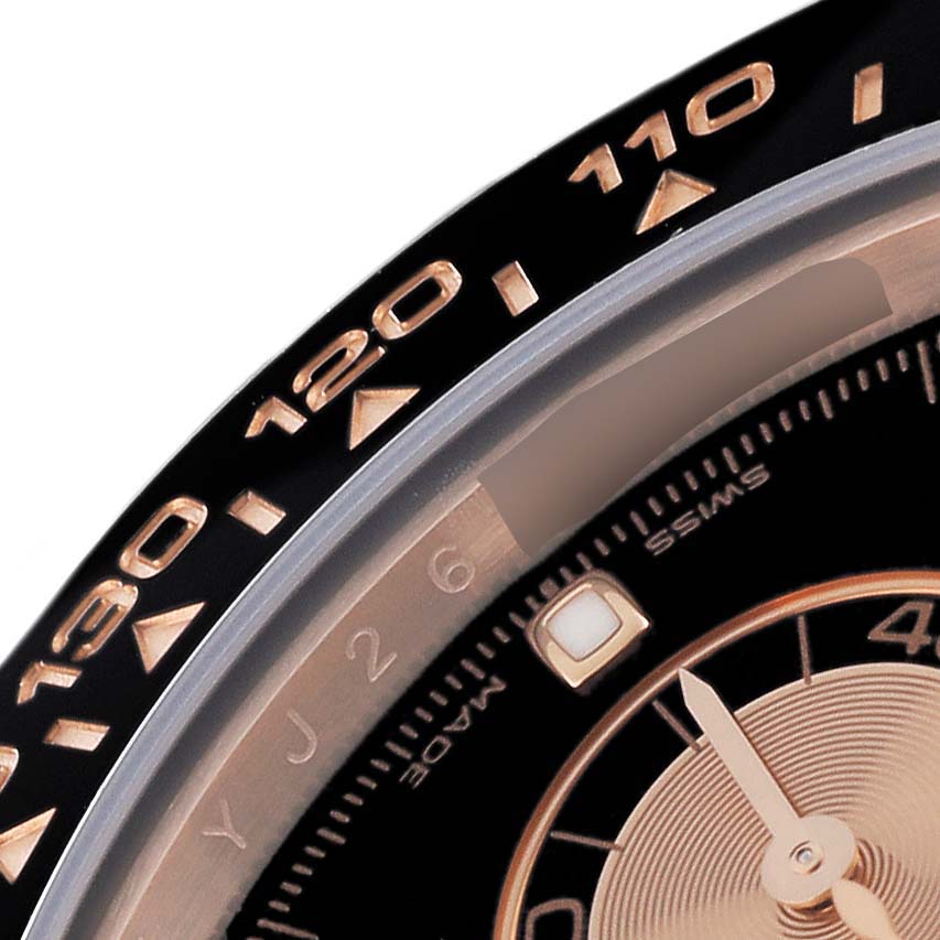 This close-up angle shows the bezel and part of the dial of a Rolex Daytona 116515 Men's Rose Gold Black Dial 116515 Men's Rose Gold Black Dial watch.