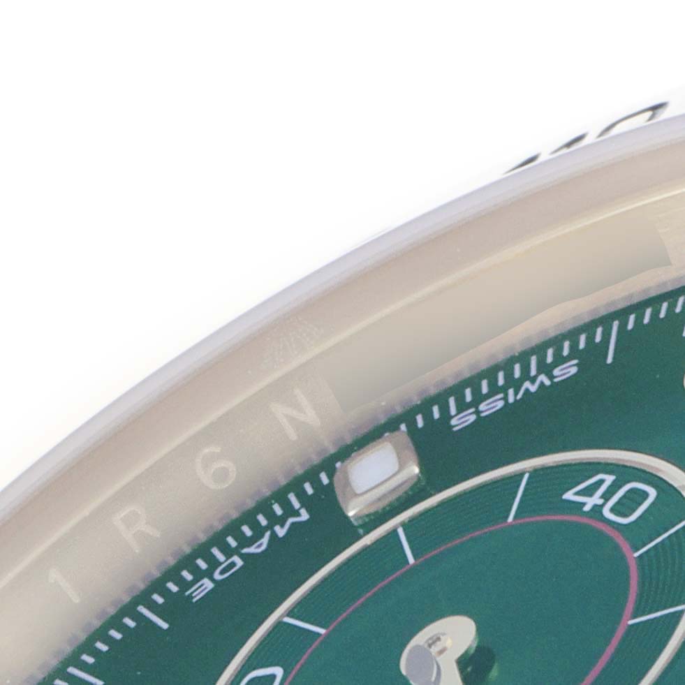The image shows a close-up angle of the dial and bezel of a Rolex Daytona 116508 Men's Yellow Gold Green Dial 116508 Men's Yellow Gold Green Dial watch.