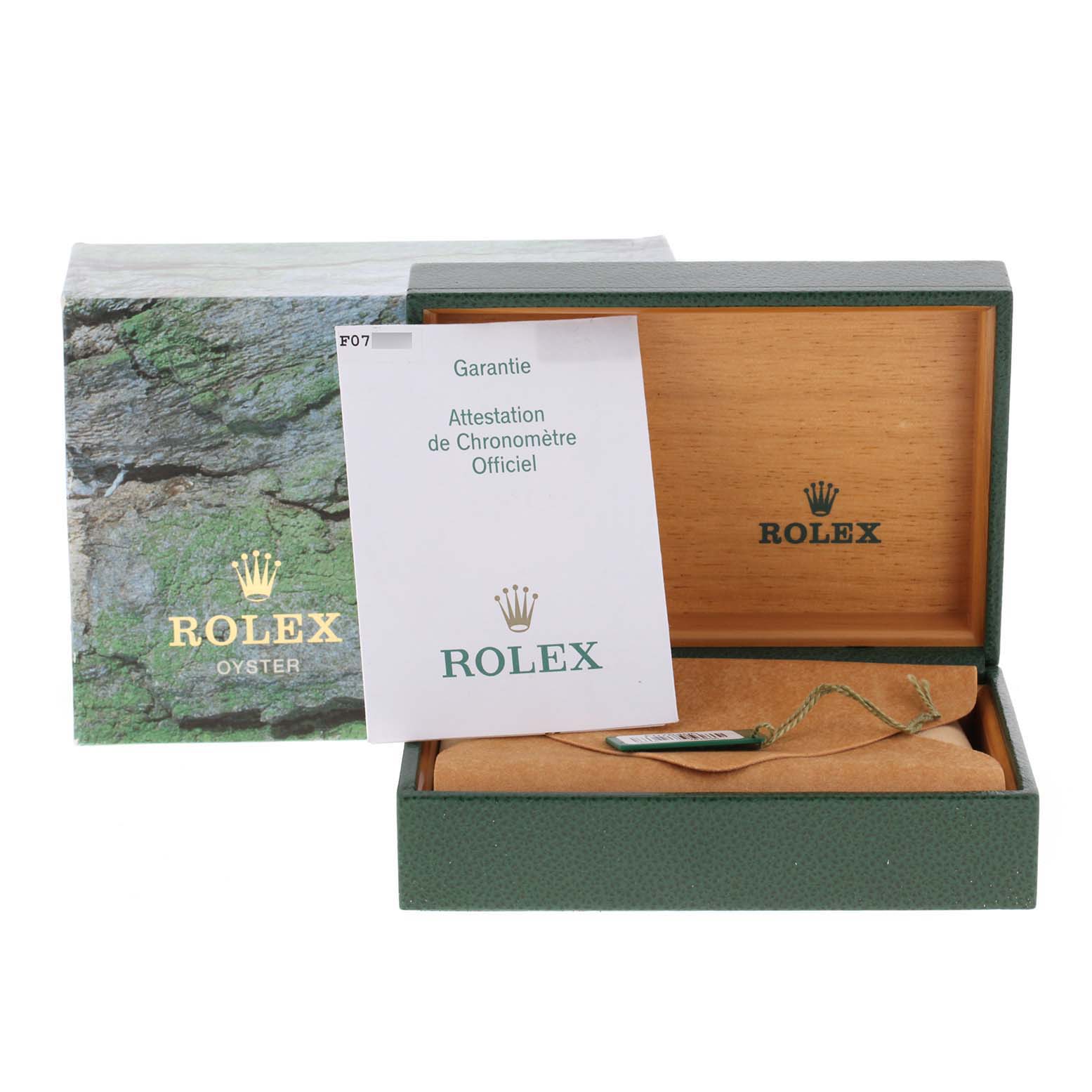 The image shows the original packaging and warranty certificate for a Rolex Explorer 16570 Men's Stainless Steel White Dial 16570 Men's Stainless Steel White Dial model watch.