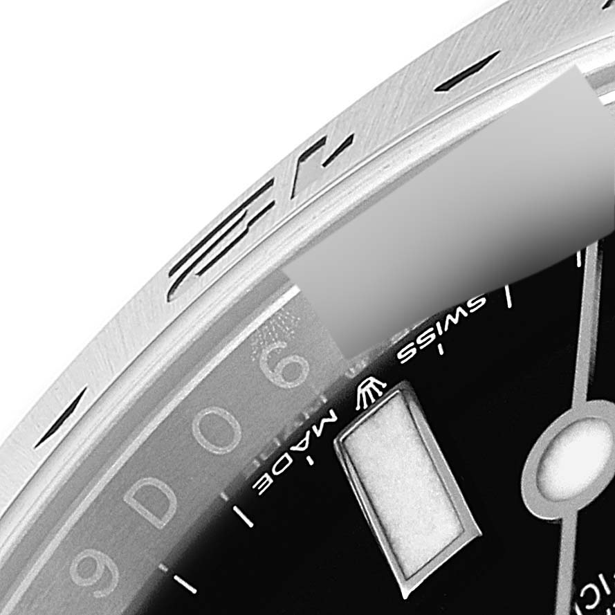 This image shows a close-up of the dial, bezel, and markers on a Rolex Explorer 226570 Men's Stainless Steel Black Dial 226570 Men's Stainless Steel Black Dial watch.