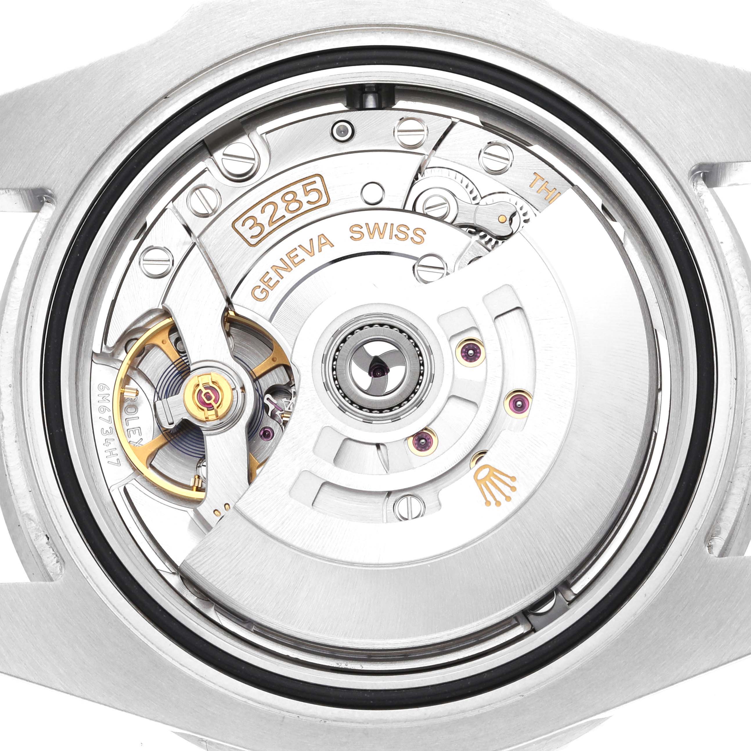 The image shows the back and internal mechanism of a Rolex GMT-Master 126710 Men's Stainless Steel Black Dial 126710 Men's Stainless Steel Black Dial watch, highlighting its intricate components.