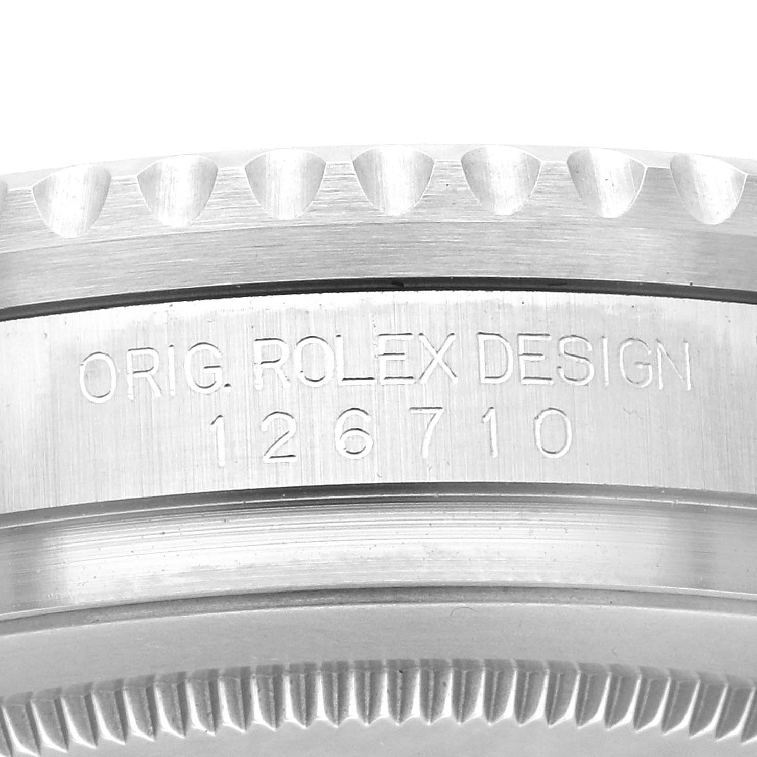 This image shows a close-up of the side of a Rolex GMT-Master 126710 Men's Stainless Steel Black Dial 126710 Men's Stainless Steel Black Dial watch, highlighting the model number "126710" and the notched bezel edge.