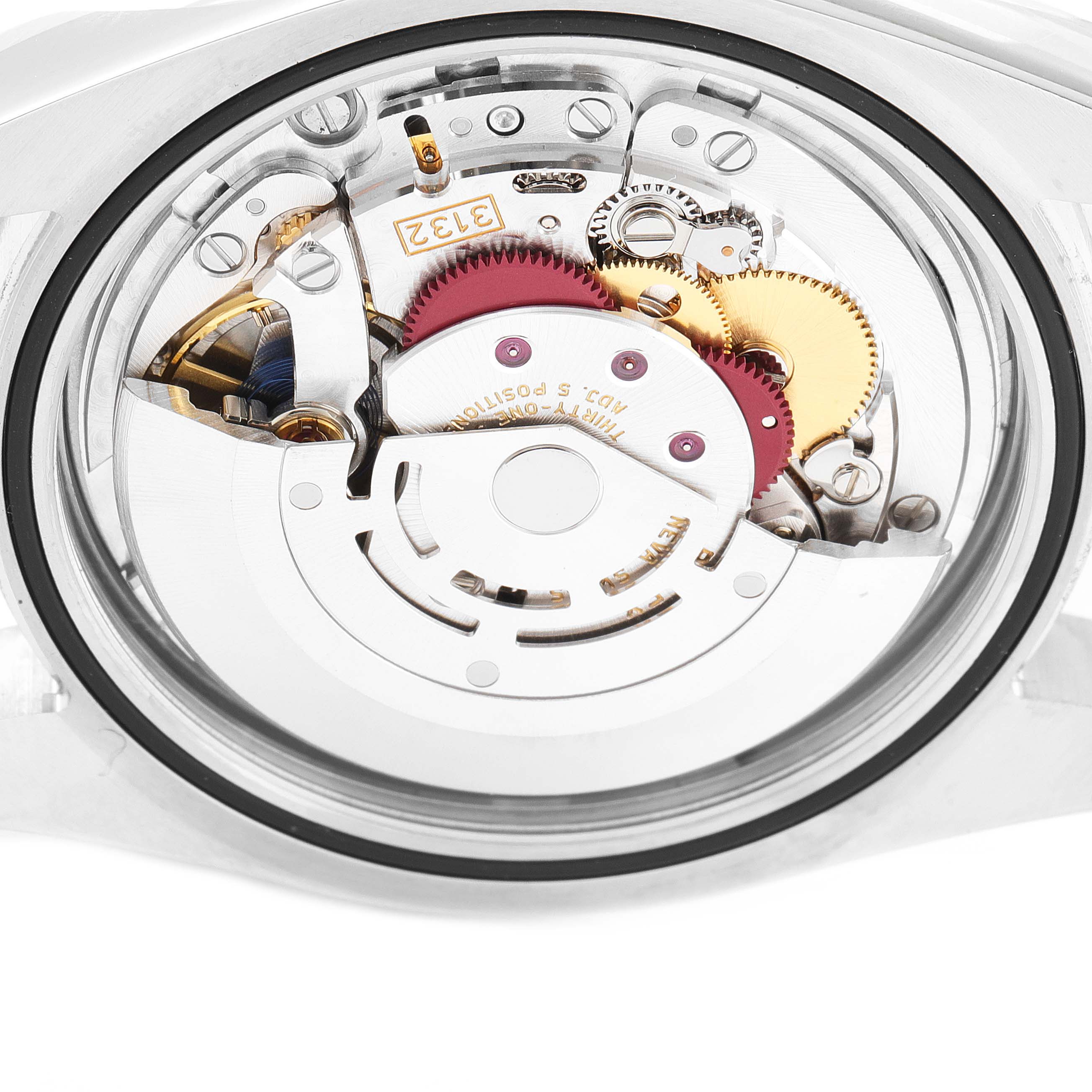 This is a close-up view of the movement inside a Rolex Oyster Perpetual 114300 Men
s Stainless Steel Blue Dial 114300 Men
s Stainless Steel Blue Dial watch, showing gears and internal components.