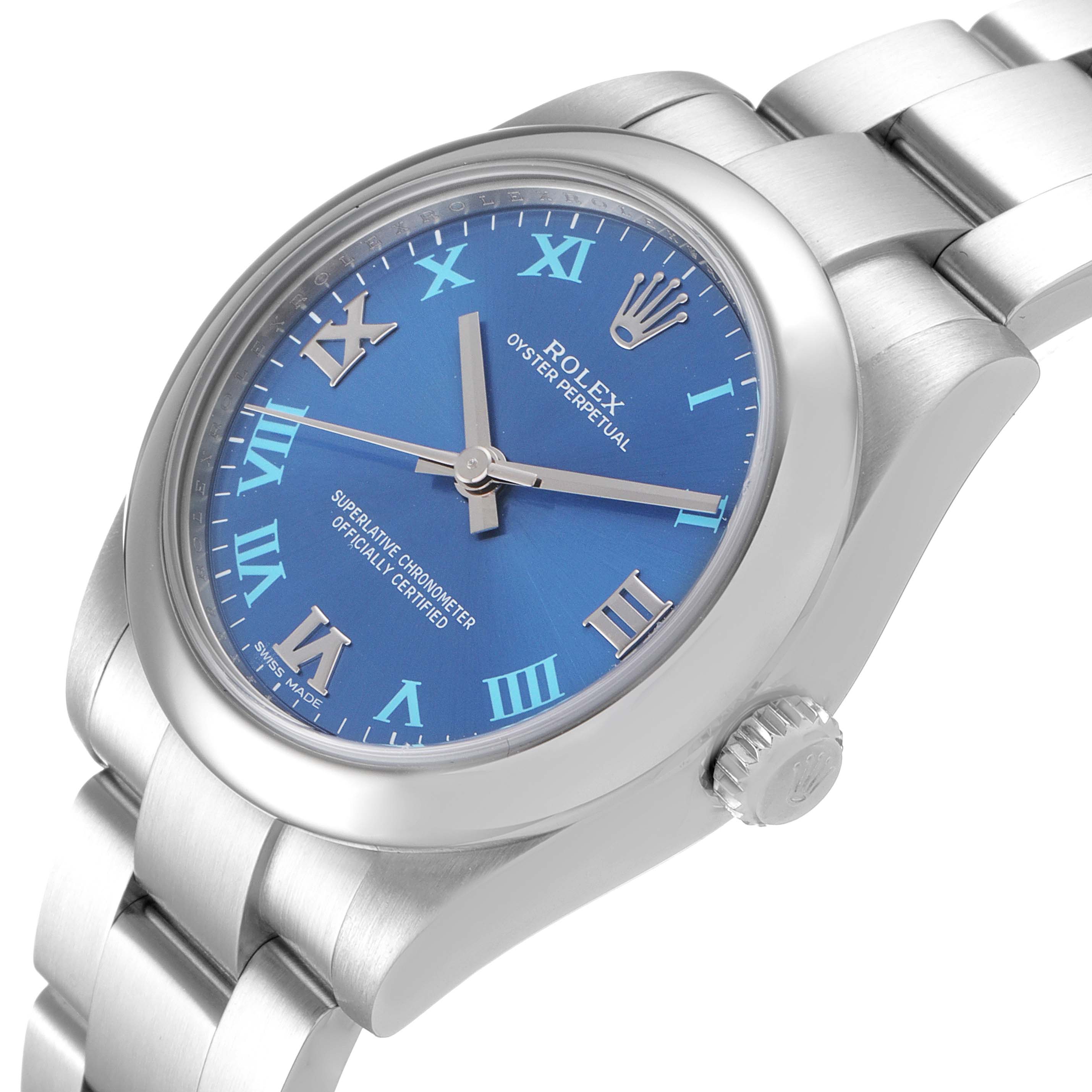 The image shows a side angle of a Rolex Oyster Perpetual Mid-Size watch, highlighting the blue dial, hands, crown, and part of the bracelet.