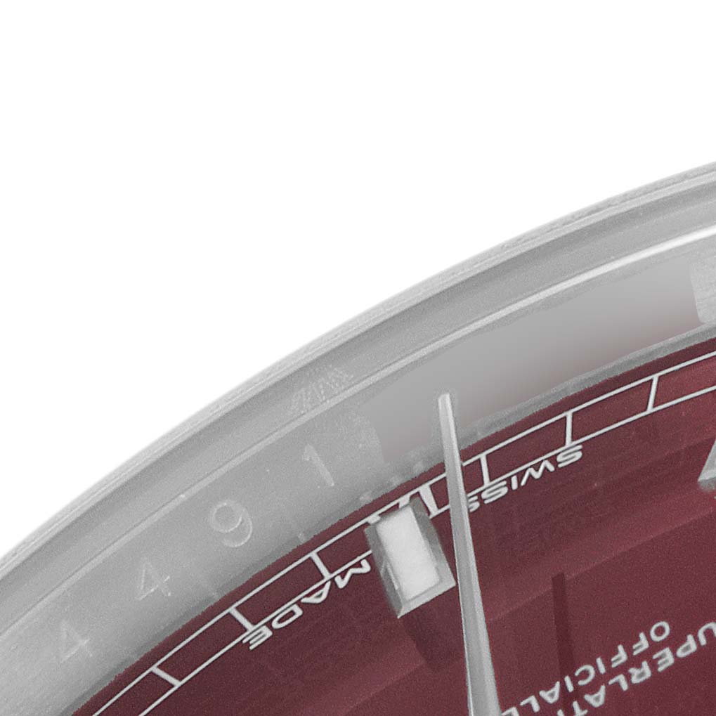 This image shows a close-up of the dial and part of the bezel of a Rolex President 118139 Men's White Gold Burgundy Dial 118139 Men's White Gold Burgundy Dial model watch.