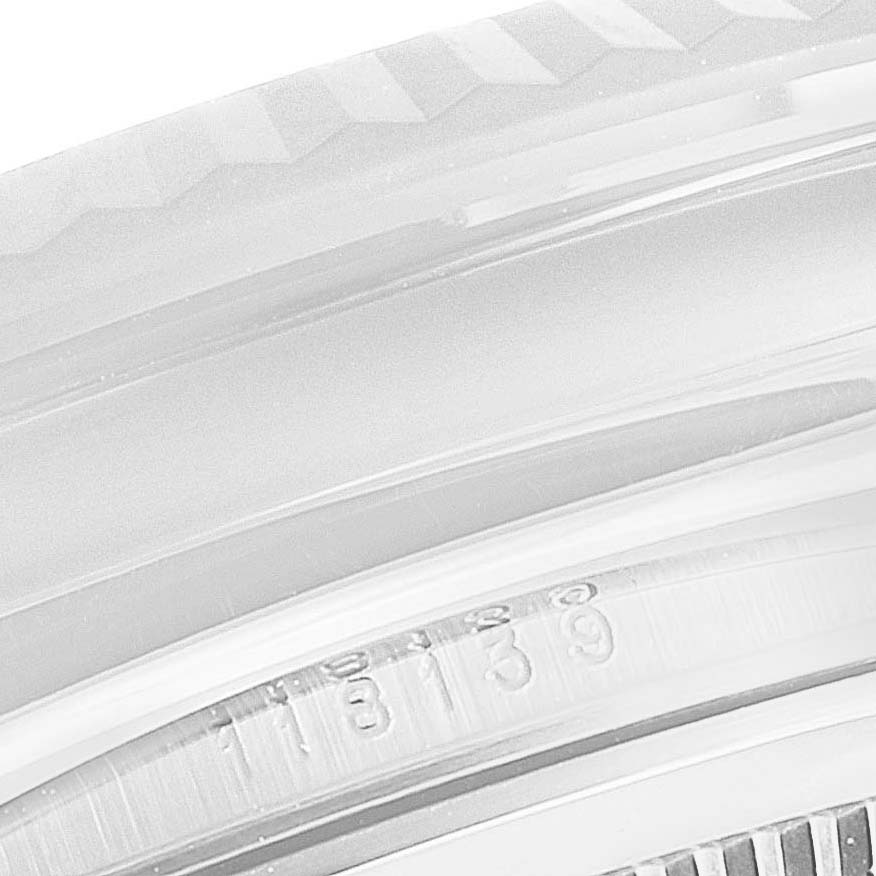 The image shows a close-up of the bezel and the serial number of the Rolex President 118139 Men's White Gold Burgundy Dial 118139 Men's White Gold Burgundy Dial model watch.