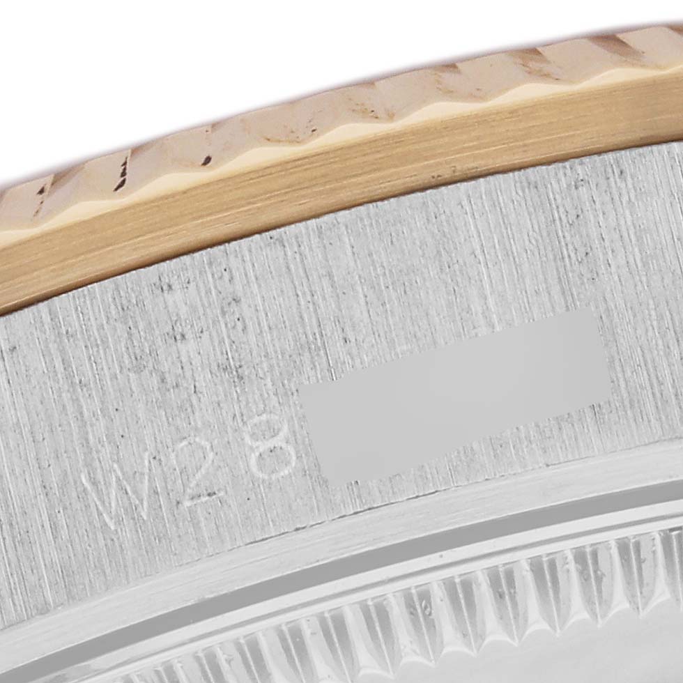 This close-up image shows part of the bezel and case of a Rolex President 68279 Women's White Gold Champagne Dial 68279 Women's White Gold Champagne Dial model watch.