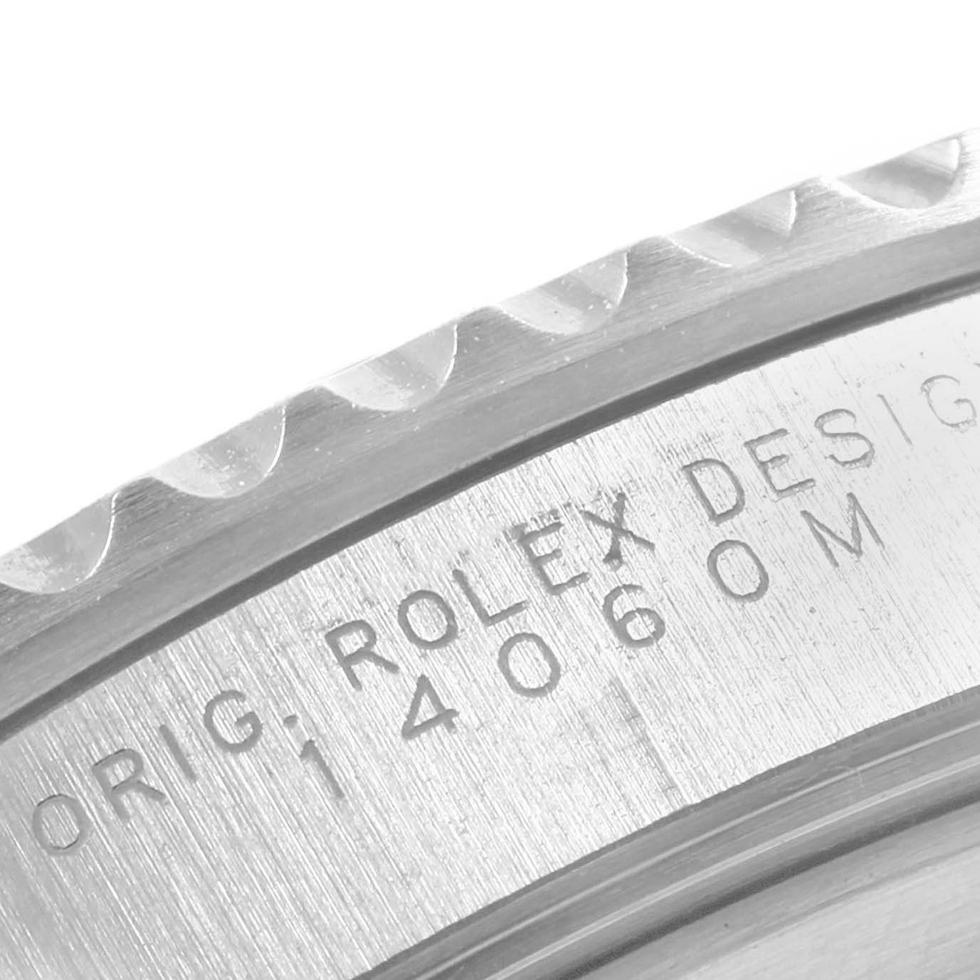 The image shows a close-up of the bezel and case edge of a Rolex Submariner 14060 Men
s Stainless Steel Black Dial 14060 Men
s Stainless Steel Black Dial watch.