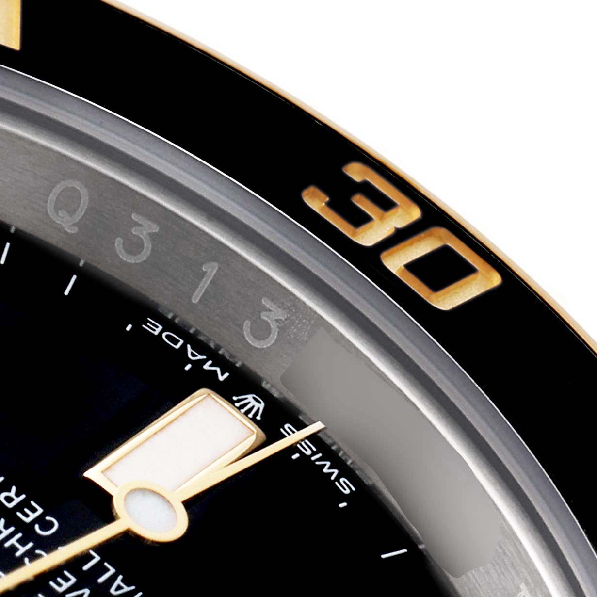 Close-up view of the Rolex Submariner 126613 Men's Steel and Gold (two tone) Black Dial 126613 Men's Steel and Gold (two tone) Black Dial showing part of the bezel with the "30" marking, dial, and second hand.