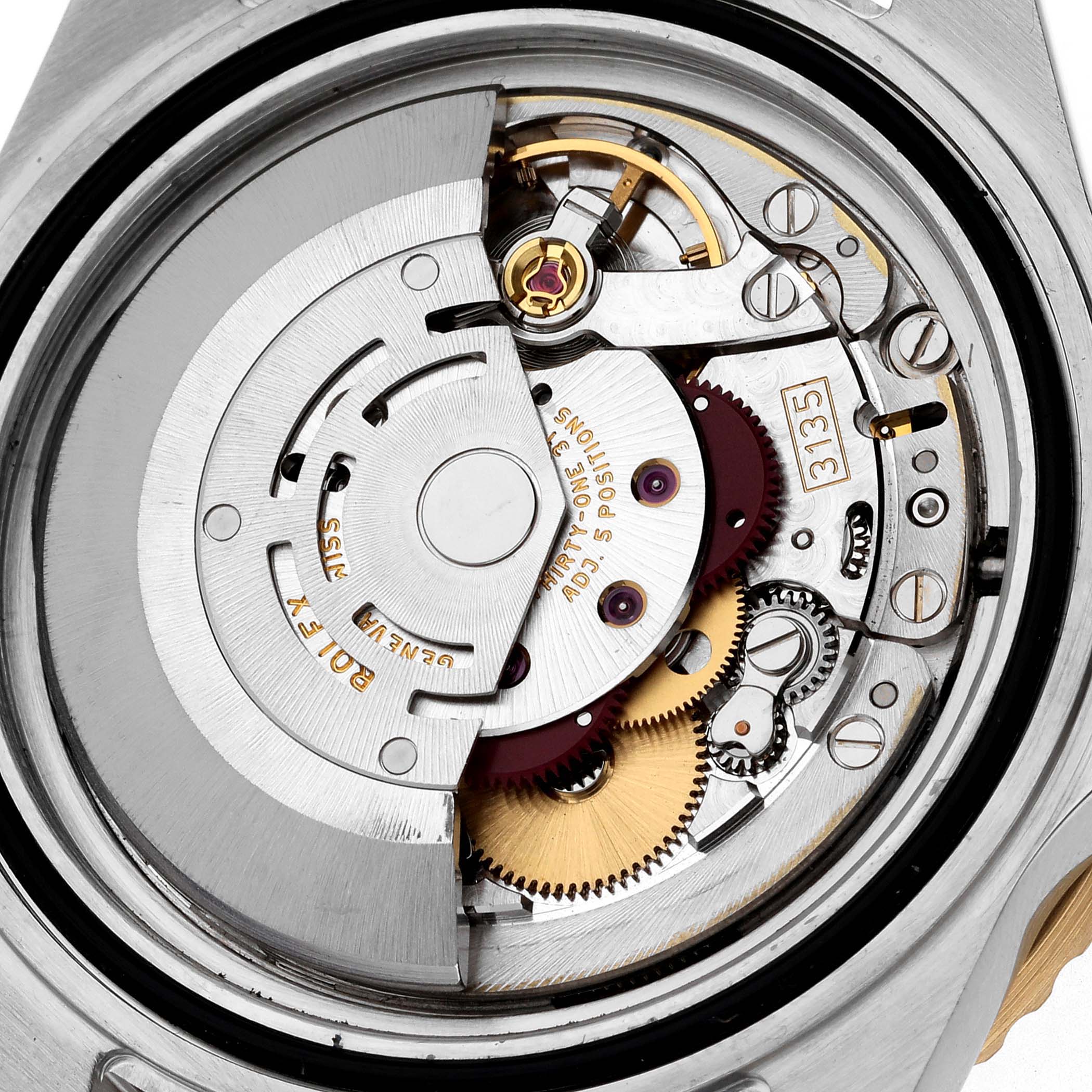 The image shows an inside view of the Rolex Submariner 16613 Men's Steel and Gold (two tone) Blue Dial 16613 Men's Steel and Gold (two tone) Blue Dial, focusing on its intricate movement and internal components.