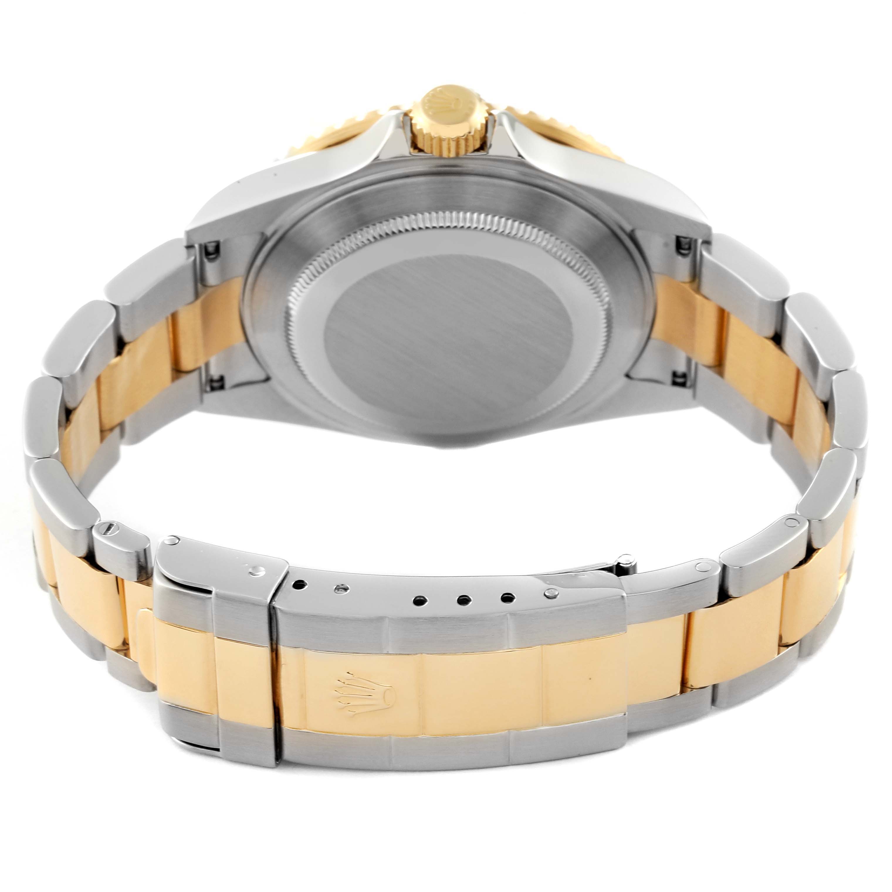 The image shows the Rolex Submariner 16613 Men's Steel and Gold (two tone) Blue Dial 16613 Men's Steel and Gold (two tone) Blue Dial from the back, highlighting the case, crown, and two-tone bracelet.