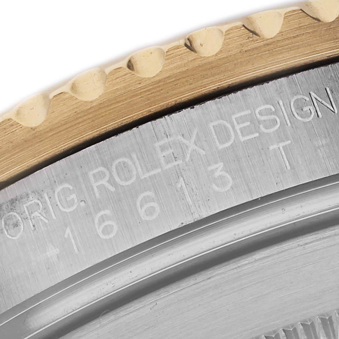 This image shows a close-up view of the bezel and part of the case back of a Rolex Submariner 16613 Men's Steel and Gold (two tone) Blue Dial 16613 Men's Steel and Gold (two tone) Blue Dial watch, model number 16613.