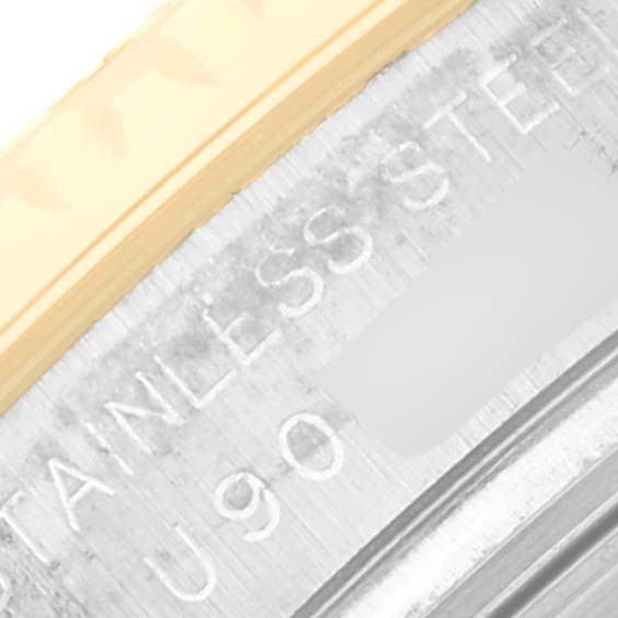 This image shows a close-up of the side engraving on the case of a Rolex Yacht-Master 69623 Women's Steel and Gold (two tone) White Dial 69623 Women's Steel and Gold (two tone) White Dial watch, highlighting the "Stainless Steel" inscription.